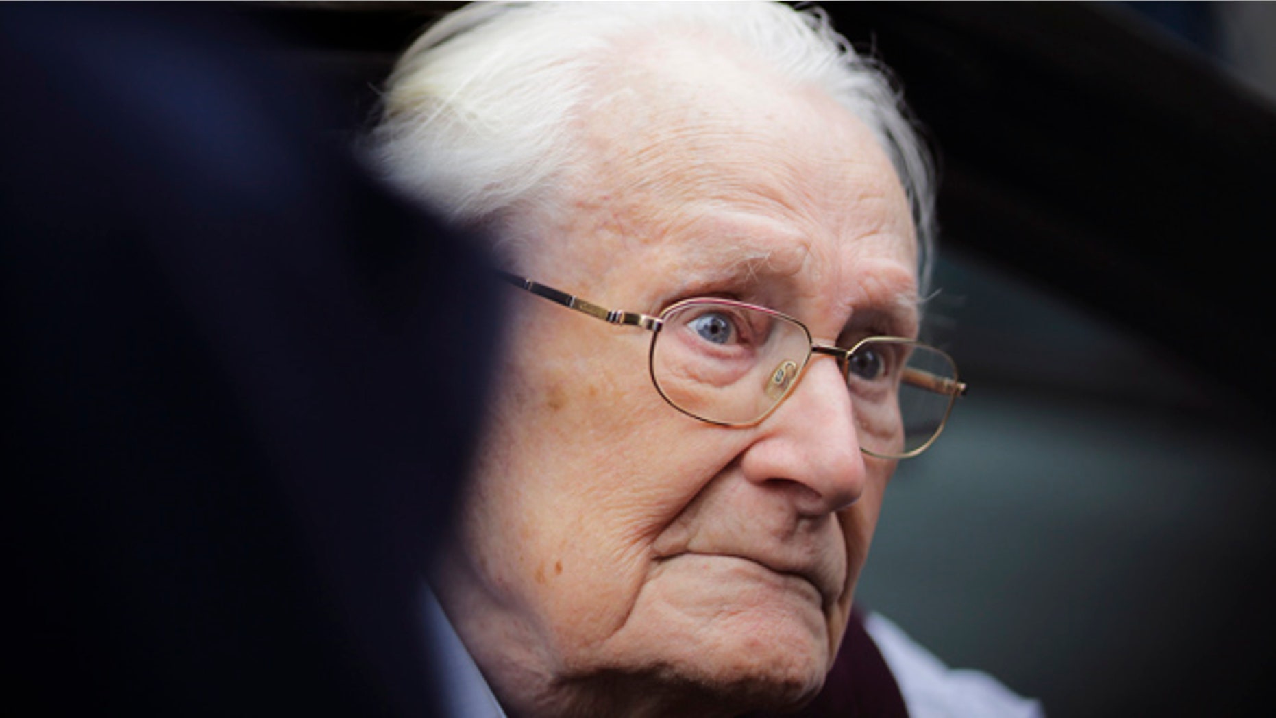July 15, 2015: Former SS sergent Oskar Groening arrives for the judgement at the trial against him in in Lueneburg, Germany. Groening, 94, who is accused of helping to operate the death camp Auschwitz between May and June 1944, has been convicted on 300,000 counts of accessory to murder. The state court gave Groening a four-year sentence. (AP Photo/Markus Schreiber)