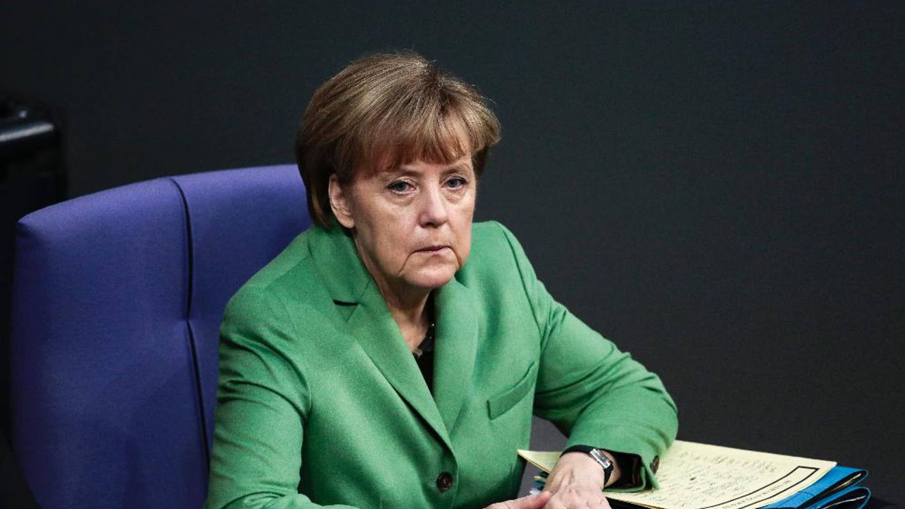 German Chancellor Angela Merkel attends the final four days debate of a debt free national budget for 2015 at the parliament Bundestag in Berlin, Germany, Tuesday, Nov. 25, 2014. (AP Photo/Markus Schreiber)