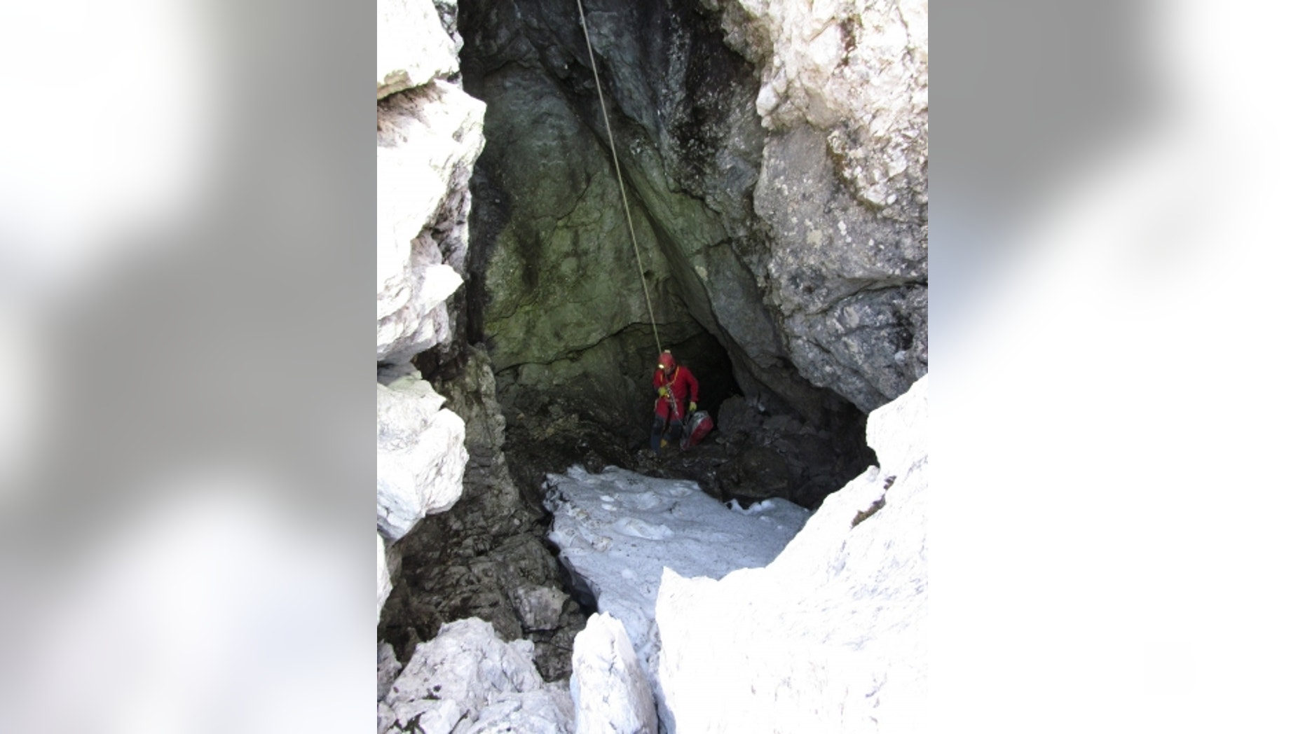 June 8, 2014 - Rescuer enters a cave near Berchtesgaden, Germany. Rescuers were working to recover a man stuck deep inside a cave in the German Alps after he was injured by falling rocks Sunday an effort that police said could take days.