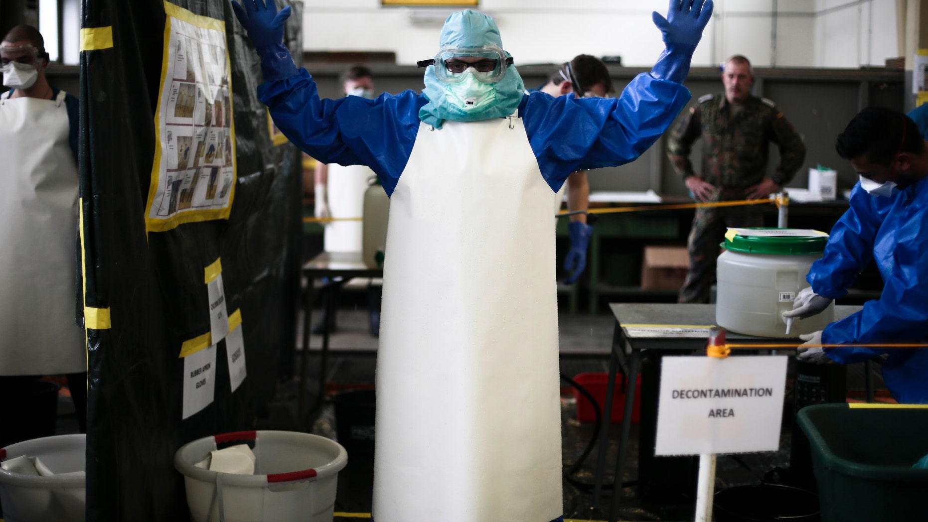 Oct. 23, 2014: A volunteer of the German forces Bundeswehr gets sprayed a bleach mixture on his protective suit during a training for the Ebola virus in Appen about 15.5 miles north of Hamburg, Germany.