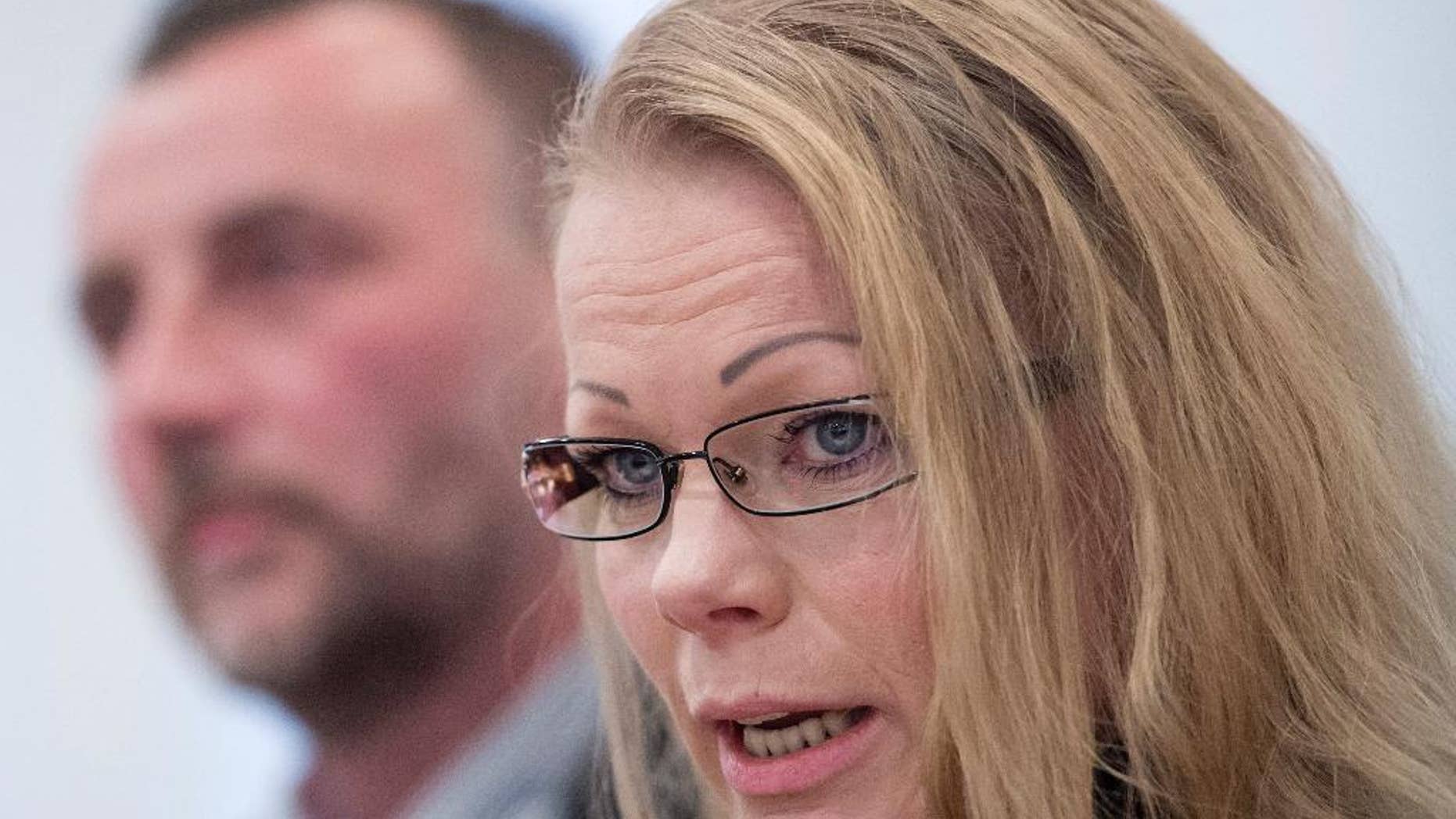 FILE - In this Jan. 19, 2015 file picture Organizers Lutz Bachmann, left, and Kathrin Oertel attend a news conference of the group 'Patriotic Europeans against the Islamization of the West' (PEGIDA) in Dresden, Germany, The PEGIDA organization said on its Facebook site Wednesday Jan. 28, 2015 that spokeswoman Kathrin Oertel had resigned after receiving threats, while board member Thomas Tallacker had stepped down for work reasons. Organizer Bernd-Volker Lincke told the Frankfurter Allgemeine Zeitung he and two others had also resigned. Last week, PEGIDA co-founder Lutz Bachmann quit after online posts surfaced in which he used derogatory language to refer to refugees and posed looking like Adolf Hitler. (AP Photo/Jens Meyer)