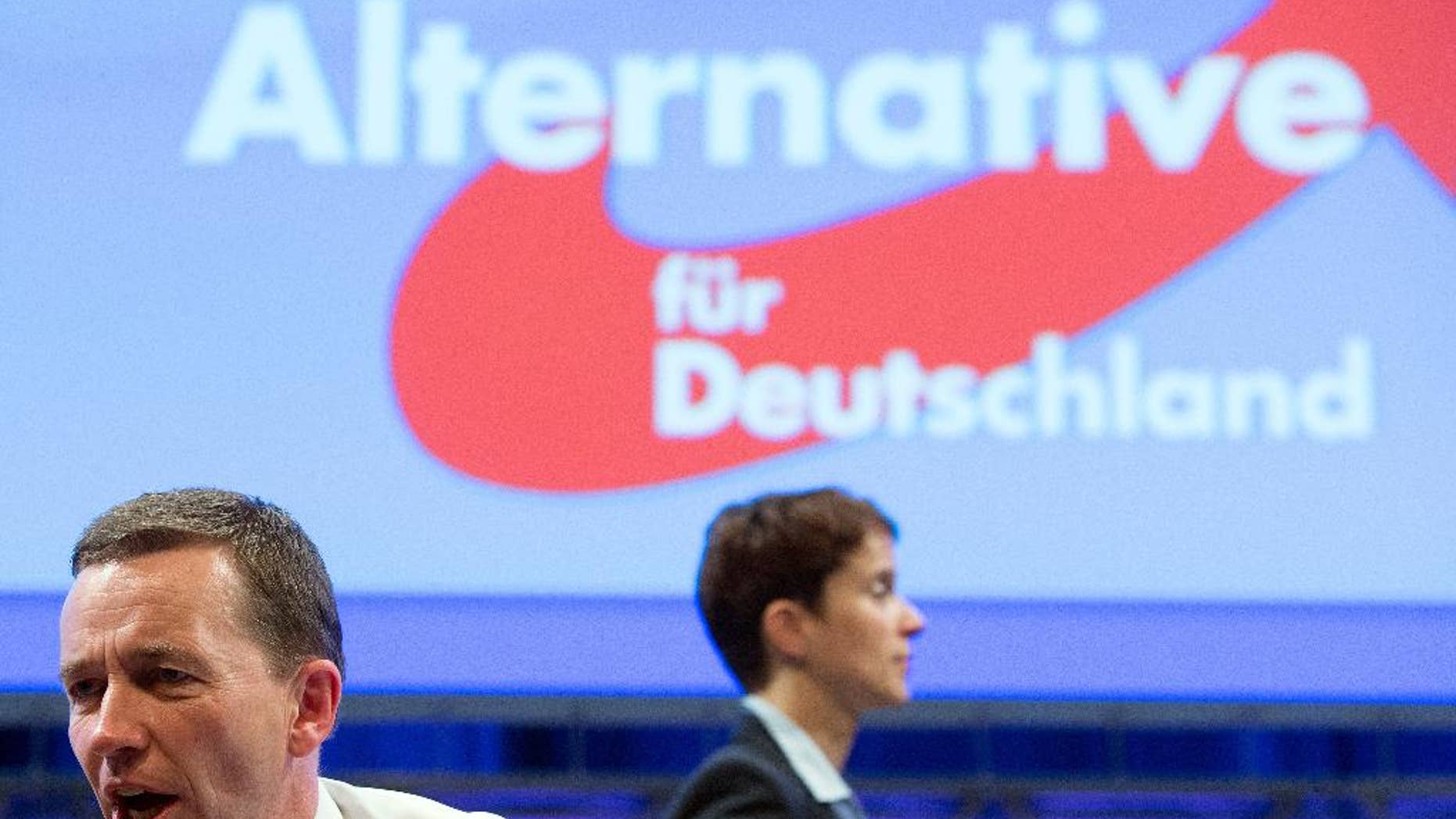 In this July 4, 2015 picture Alternative fuer Deutschland party co-chairs Bernd Lucke , left, and Frauke Petry attend the party conference in Essen, Germany. The upstart Alternative for Germany party has replaced its euroskeptic leader with a conservative from the east who wants to place greater emphasis on immigration. A majority of AfD members backed Frauke Petry in the leadership vote Saturday against Bernd Lucke, who led the party during its successful bids in the past two years to enter the European Parliament and five German state assemblies.(Frederico Gambarini/dpa via AP))