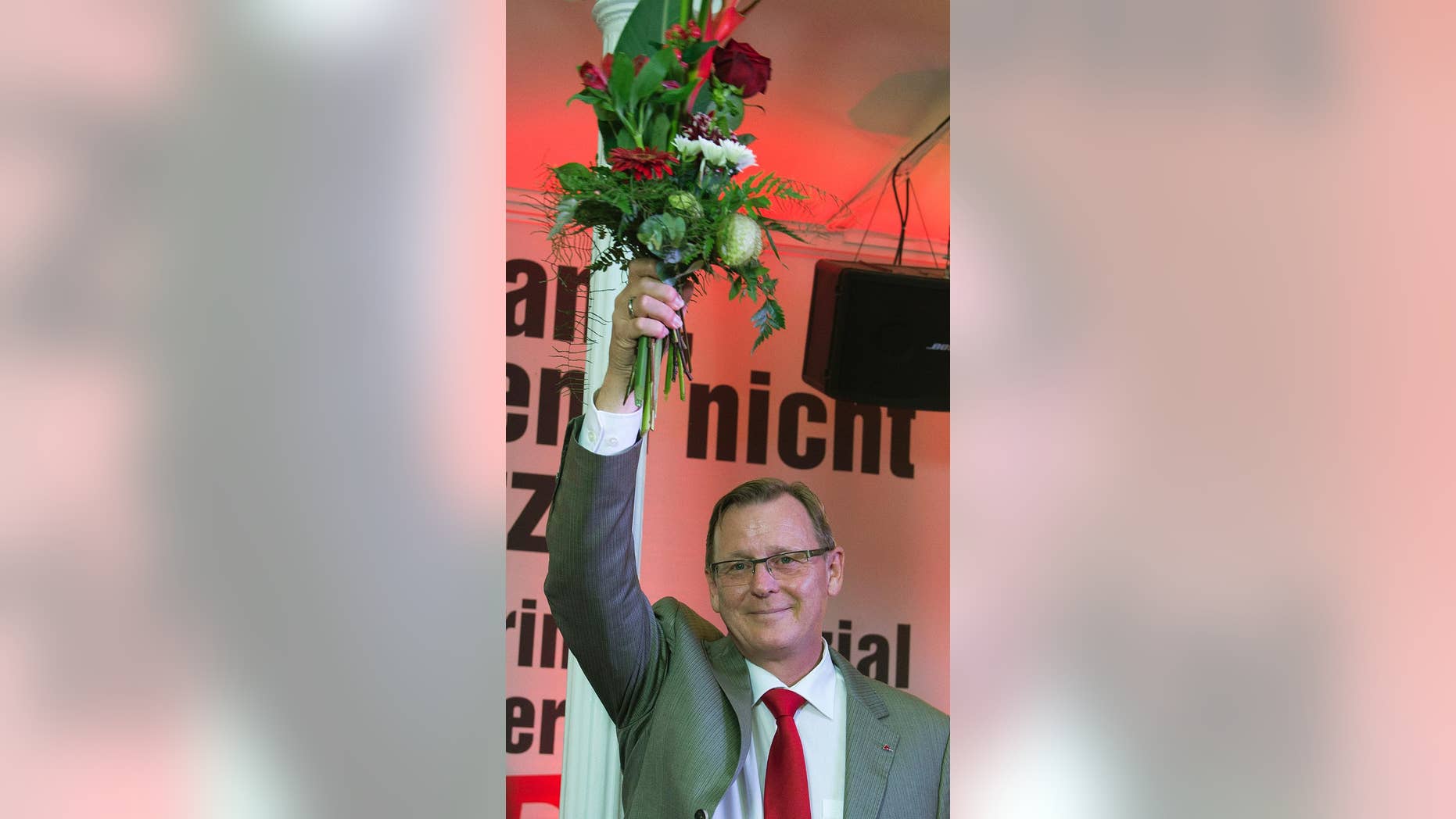 FILE - In this Sept. 14, 2014 file photo Bodo Ramelow, top candidate of German party 'Die Linke' (The Left) for the regional parliament elections in Thuringia, celebrates after the state parliament elections in Thuringia in Erfurt, central Germany. Germany’s president Joachim Gauck, a former East German pro-democracy activist, is voicing unease at the prospect of the nation’s first state governor from a party with communist roots. Ramelow looks likely to emerge as governor of eastern Thuringia state in a three-party coalition following an inconclusive September election. (AP Photo/Jens Meyer, file)