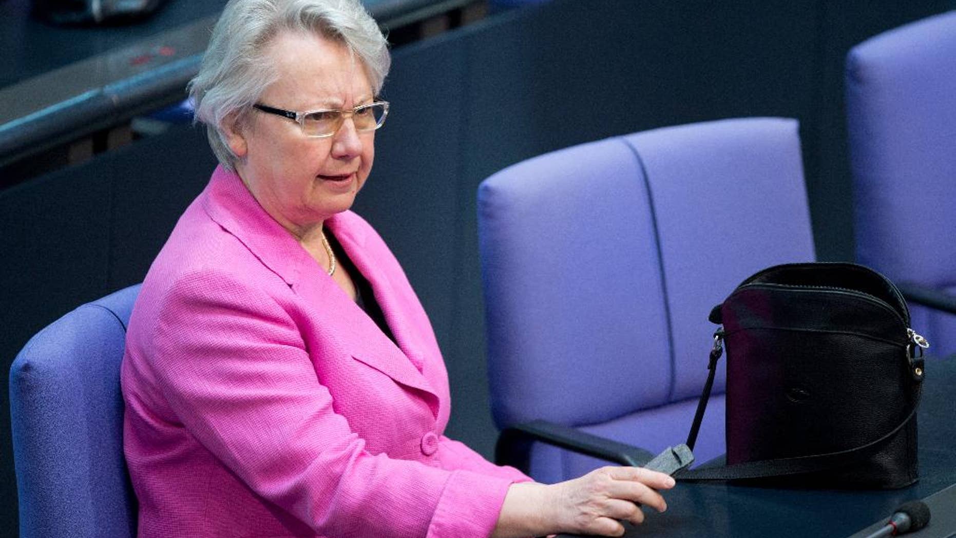 Former German Education Minister Anette Schavan, attends a session in the German parliament in Berlin, Thursday March 20, 2014. The former German minister who quit over plagiarism allegations has failed in a bid to have a court reverse the withdrawal of her doctorate.Annette Schavan, considered a close ally of Chancellor Angela Merkel, was Germany’s education minister for more than seven years until she resigned in Feb. 2013. She stepped down after an academic panel at Duesseldorf's Heinrich Heine University voted to revoke her doctorate. An administrative court in Duesseldorf on Thursday upheld that decision. (AP Photo/dpa, Maurizio Gambarini)