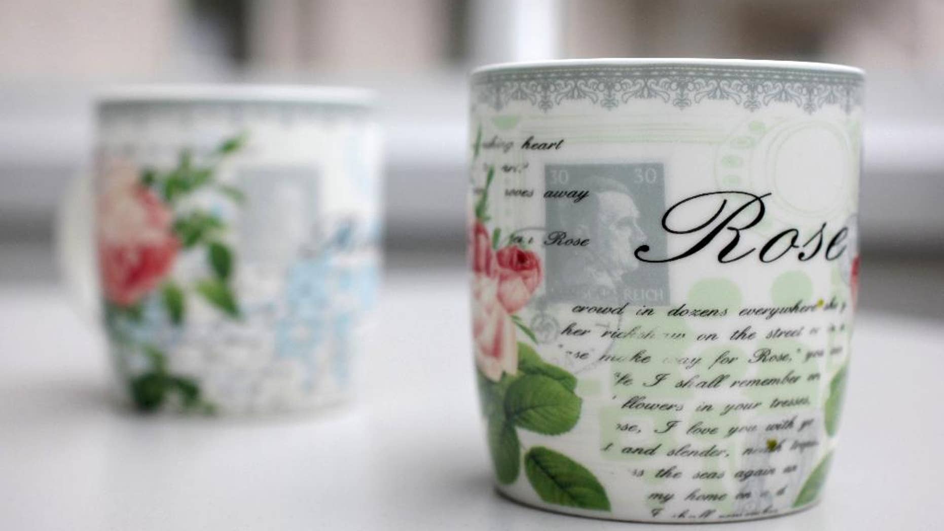 Coffee cups with a small Hitler portrait are pictured in Bielefeld Germany, Thursday, April 10, 2014. A small German furniture chain says it inadvertently ordered several thousand of these coffee cups bearing a faint portrait of Adolf Hitler from China. Christian Zurbrueggen, co-owner of the Zurbrueggen chain, told German news agency dpa on Thursday that 175 of the offending cups were sold before customers pointed out the problem. Zurbrueggen said: “I want to take the cups out of circulation.” The remaining 4,825 cups have been destroyed and he says he’s offering a 20-euro (US dollar 27.60) voucher for the return of the others, sold for 1.99 euros each. (AP Photo/dpa, Oliver Krato)