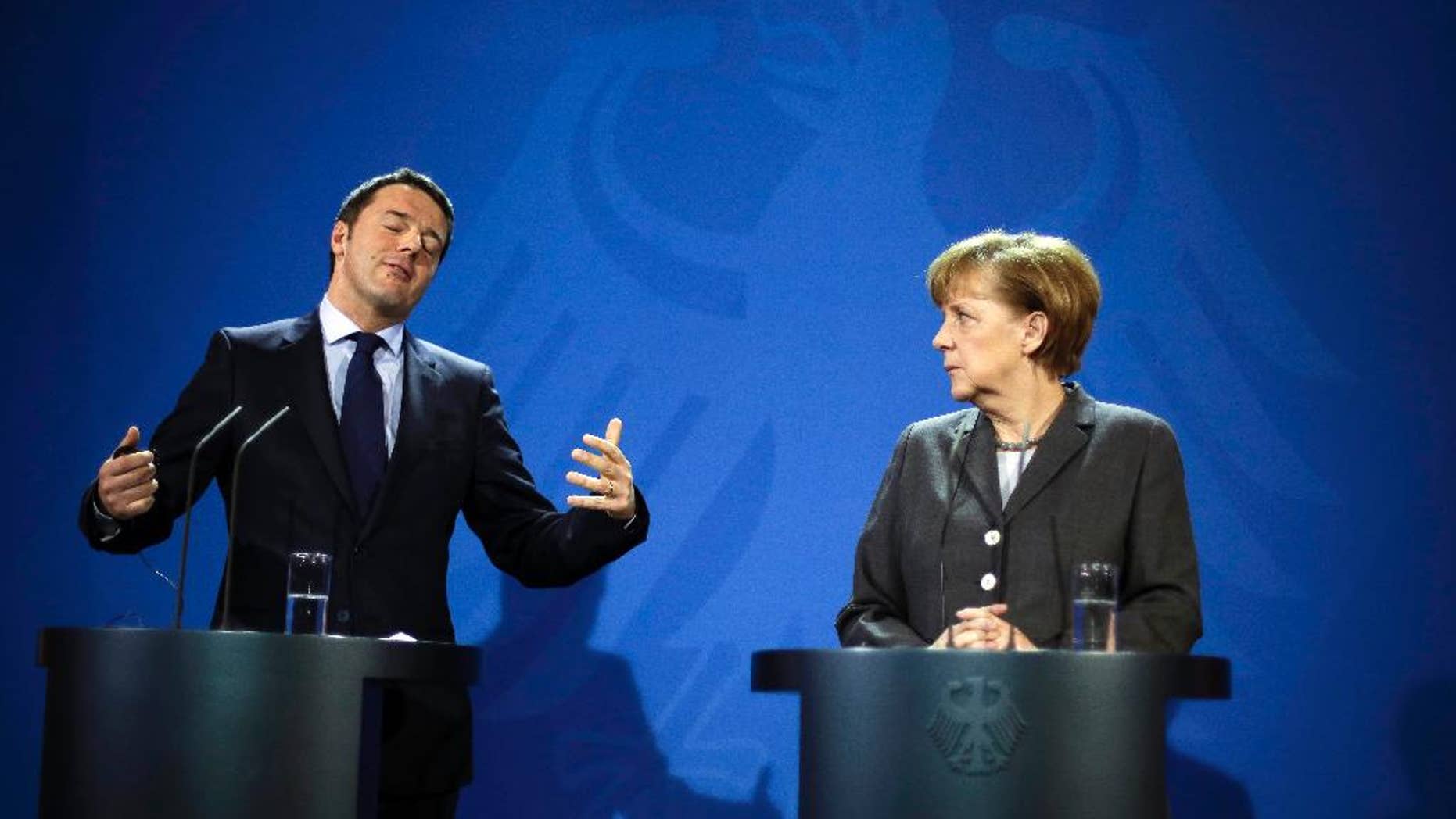 German Chancellor Angela Merkel, right and Italian Prime Minister Matteo Renzi brief the media, after German and Italian government consultations at the chancellery in Berlin, Monday, March 17, 2014. (AP Photo/Markus Schreiber)
