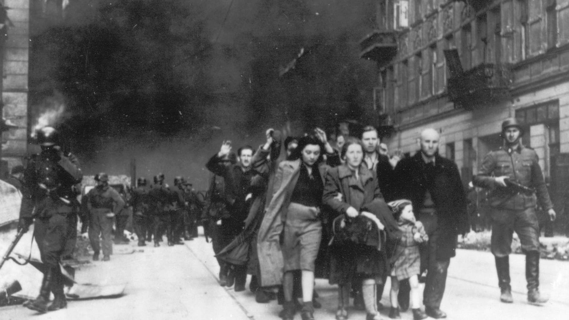 In this 1943 file photo, a group of Polish Jews are led away for deportation by German SS soldiers during the destruction of the Warsaw Ghetto by German troops after an uprising in the Jewish quarter. German Finance Minister Wolfgang Schaeuble is to sign off officially Thursday Nov. 15 2012 on revisions to the original 1952 compensation treaty, increasing pensions for those living in eastern Europe and broadening who is eligible for payments.
