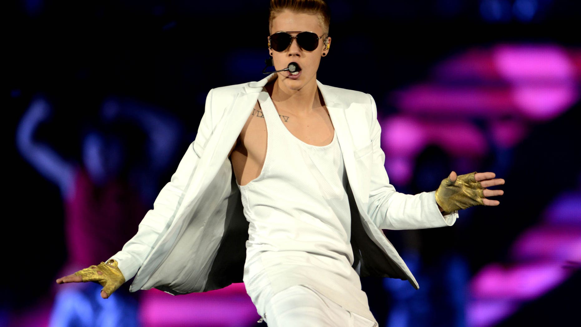 In this picture, made available Saturday April 6, 2013, Canadian singerJustin Bieber performs during a concert in Dortmund, western Germany, Friday April 5, 2013. (AP Photo/dpa,Caroline Seidel)