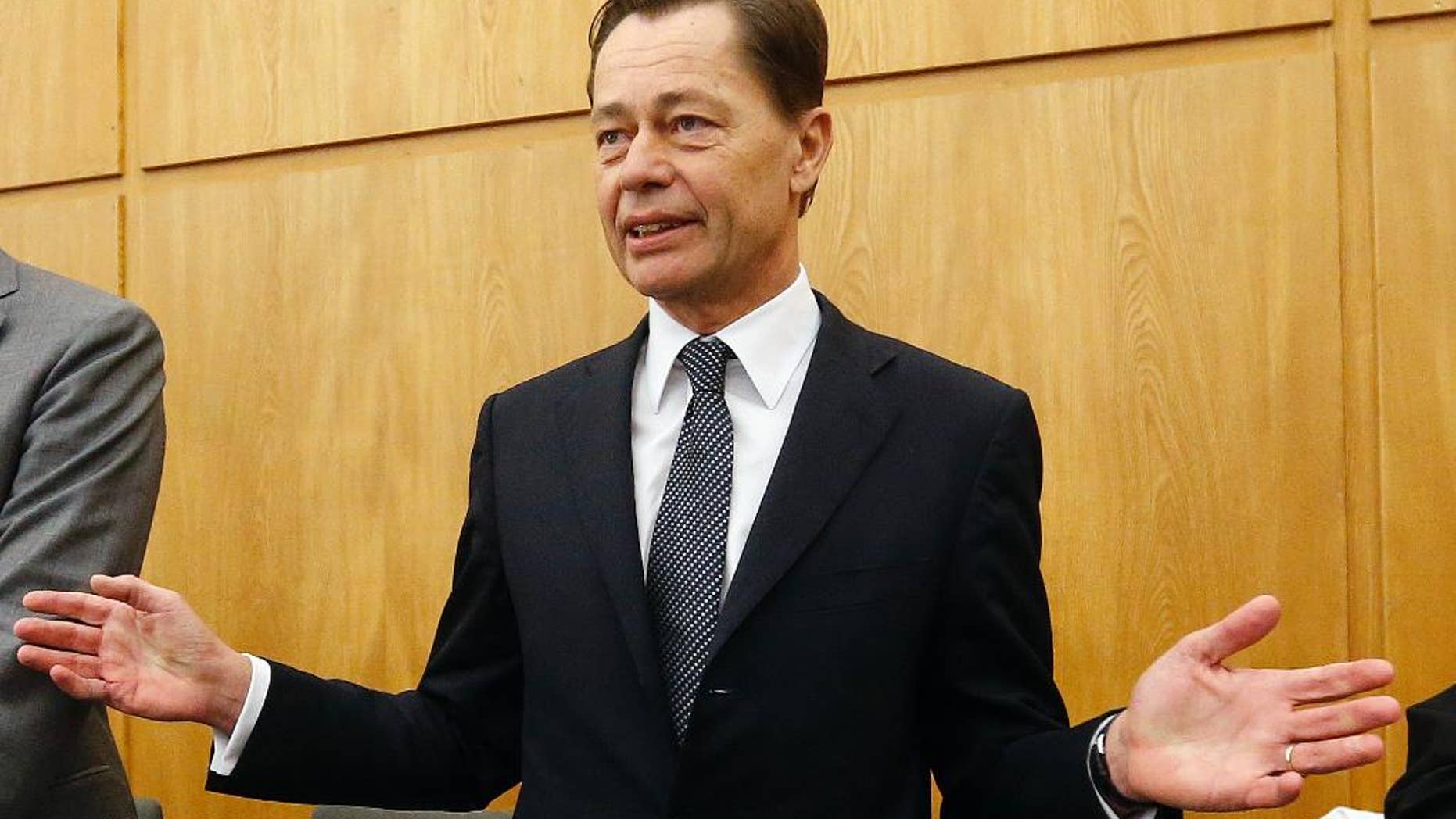 Former Arcandor CEO Thomas Middelhoff gestures in the courtroom of the district court in Essen, Germany, Friday, Nov. 14, 2014. Middelhoff is accused of embezzlement during his work for Arcandor and faces the verdict today. (AP Photo/Frank Augstein)