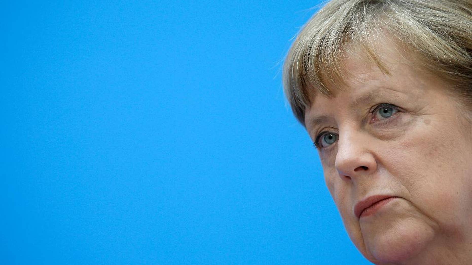 German Chancellor Angela Merkel attends a press conference in Berlin, Germany, Monday, May 11, 2015, the day after the state election in the German state of Bremen. Germany's main center-left party won the election in the country's smallest state, Bremen, and is expected to prolong its decades-long dominance there despite losing significant support. (AP Photo/Michael Sohn)