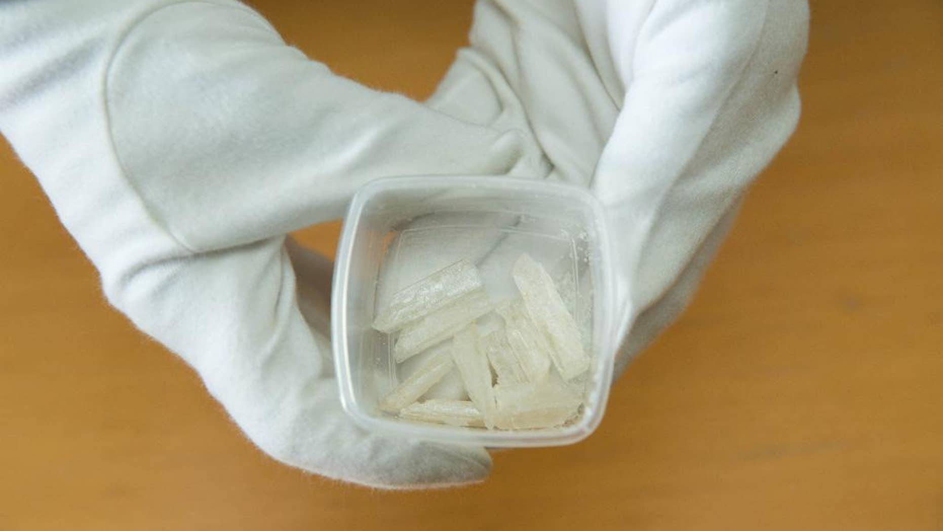 Crystal meth crystals are presented at the State Office for Criminal Investigations in Berlin, Wednesday, July 22, 2015. More than three kilograms of the drug were seized in an operation by Berlin police. (Joerg Carstensen/dpa via AP)