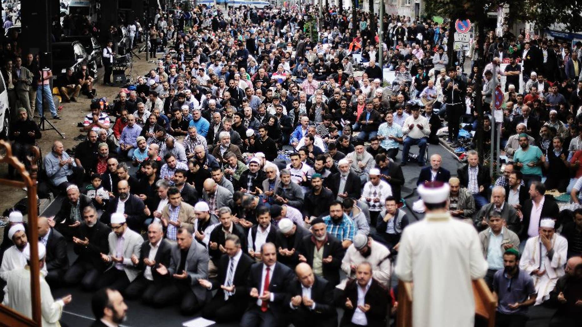 Muslims protest against the terror of the Islamic State militants after the Friday pray in Berlin, Germany, Friday, Sept. 19, 2014. The Central Council of Muslims in Germany called for rallies against the terror in nine German cites. (AP Photo/Markus Schreiber)