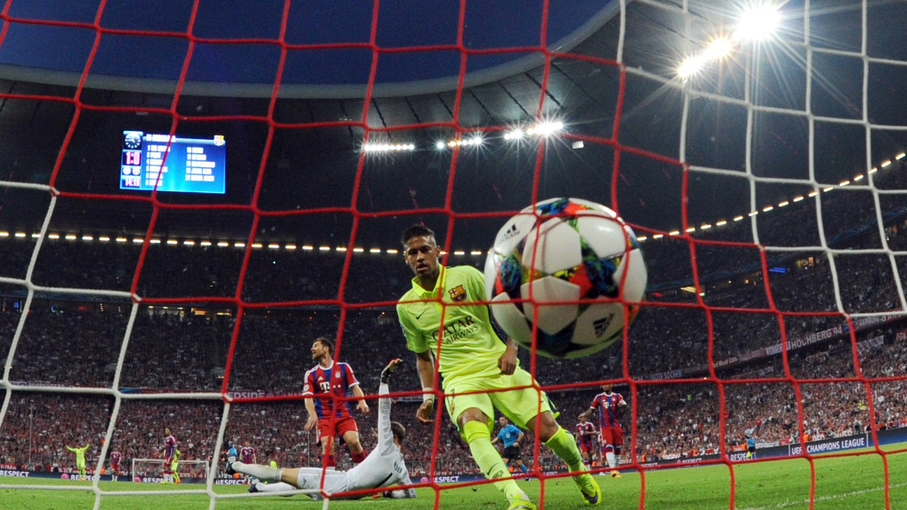 Barcelona's Neymar scores his side's opening goal during a Champions League semi final second leg soccer match between Bayern Munich and FC Barcelona in Munich, Germany, Tuesday, May 12, 2015. (Tobias Hase /dpa via AP)