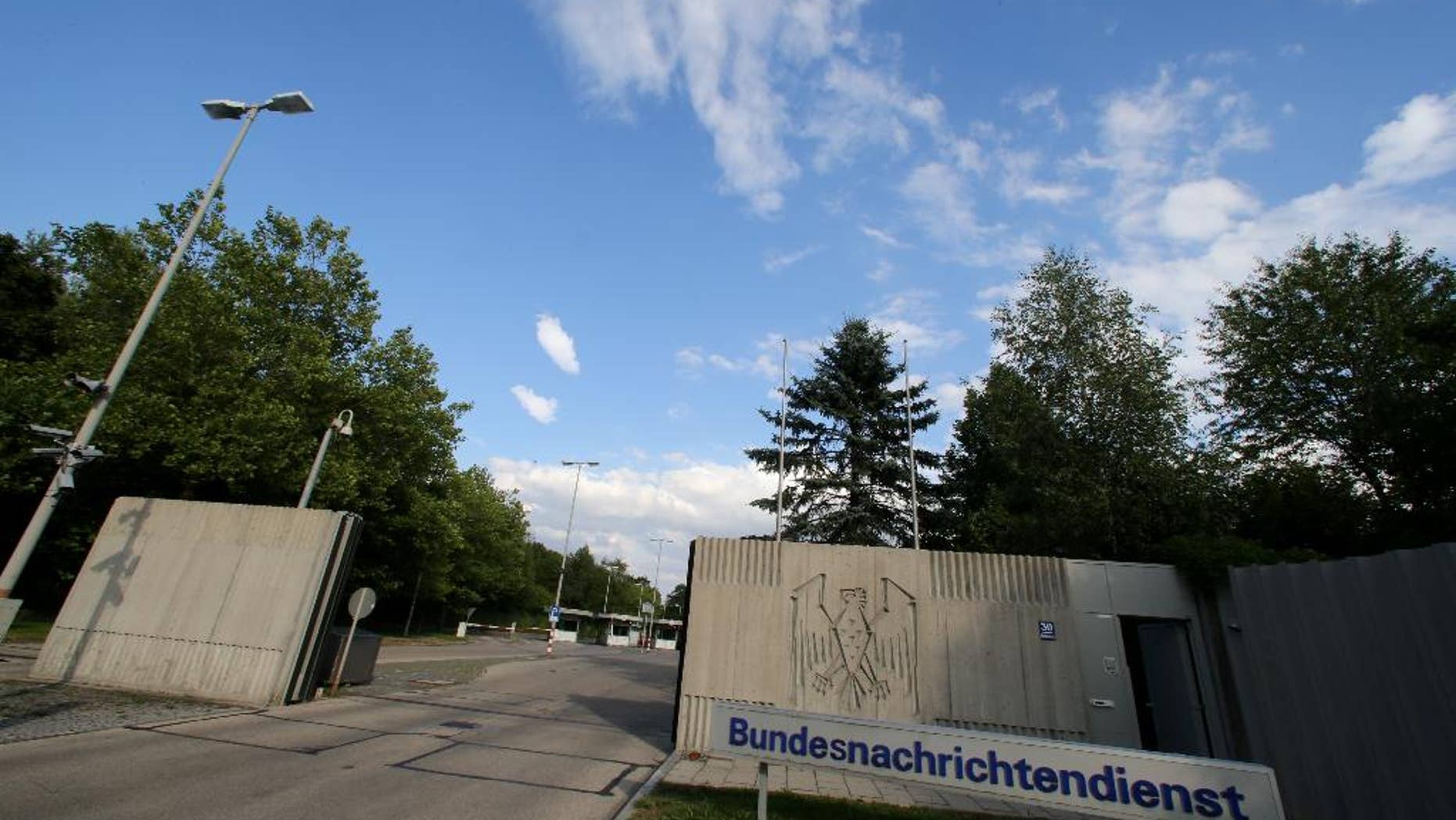 FILE - This Aug. 13, 2013 file picture shows the entrance of the Bundesnachrichtendienst ,BND, in Pullach, Germany. Prosecutors have charged a German spy with treason, breach of official secrecy and taking bribes for allegedly providing secret documents to both the CIA and Russia's intelligence agency. Prosecutors say Thursday Aug. 20, 2015, the 32-year-old man,handled mail and classified documents for Germany's foreign intelligence agency BND. ( Stephan Jansen/dpa via AP)