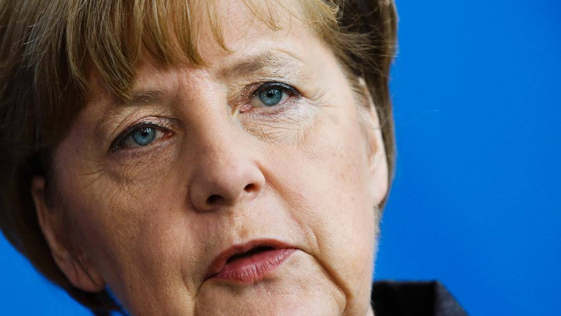 German Chancellor Angela Merkel attends a news conference with the Prime Minister of Sweden Stefan Lofven after a meeting at the chancellery in Berlin, Germany, Wednesday, Feb. 25, 2015. (AP Photo/Markus Schreiber)
