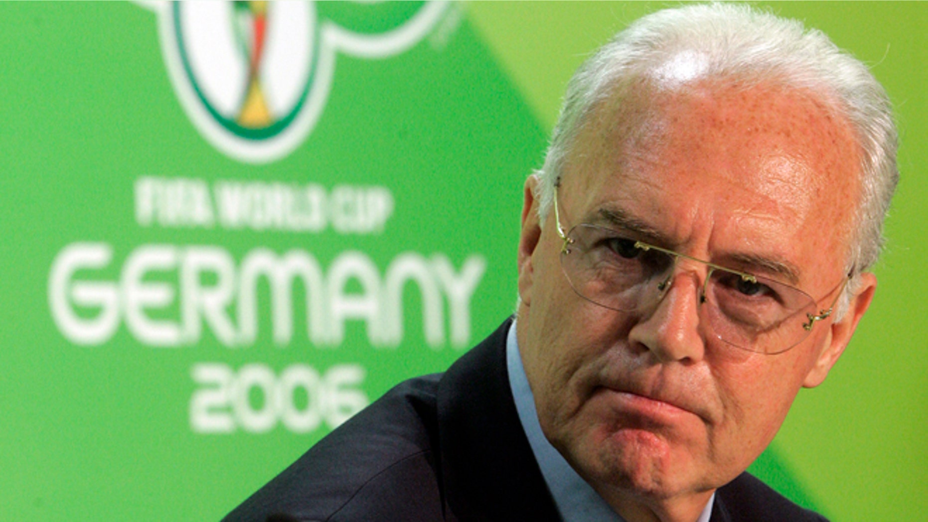 FILE - In this June 29, 2006 file picture Franz Beckenbauer, then President of the German Organization Committee of the soccer World Cup briefs the media during a news conference at the Olympic Stadium in Berlin. A highly anticipated independent report to be released Friday March 4, 2016 could throw light into corruption allegations against Germany's 2006 World Cup organizers and the fate of a dubious payment to FIFA. (AP Photo/Markus Schreiber,file)