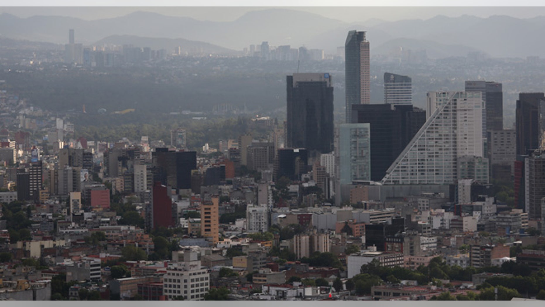 Mexico City skyline is seen through the haze from the Latino Tower in Mexico City, Mexico. (Photo by John Moore/Getty Images)