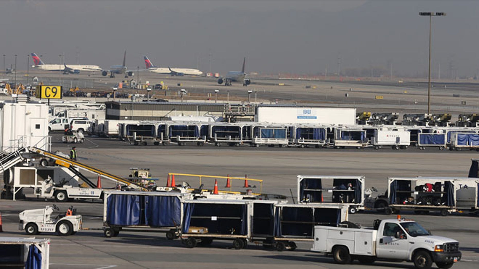 SALT LAKE CITY, UT - NOVEMBER 27: Delta planes stack up for take-off and are proceed through the Salt Lake City international Airport on November 27, 2013 in Salt Lake City, Utah. A wintry storm system that is covering much of the nation is threatening to wreak havoc on holiday travel . (Photo by George Frey/Getty Images)