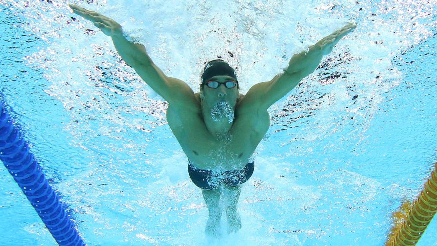 GOLD COAST, AUSTRALIA - AUGUST 24: Michael Phelps of the United States swims in the Men's 4 x 100m Medley Relay Final during day four of the 2014 Pan Pacific Championships at Gold Coast Aquatics on August 24, 2014 in Gold Coast, Australia. (Photo by Chris Hyde/Getty Images)