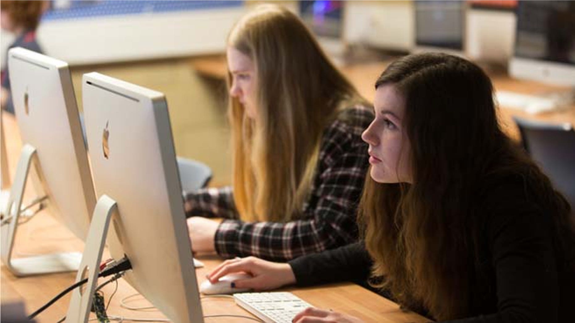 BRISTOL, UNITED KINGDOM - FEBRUARY 26: Pupils at the Ridings Federation Winterbourne International Academy use computers during a media lesson in Winterbourne near Bristol on February 26, 2015 in South Gloucestershire, England. Education, along with National Health Service and the economy are likely to be key election issues in the forthcoming general election in May. (Photo by Matt Cardy/Getty Images)