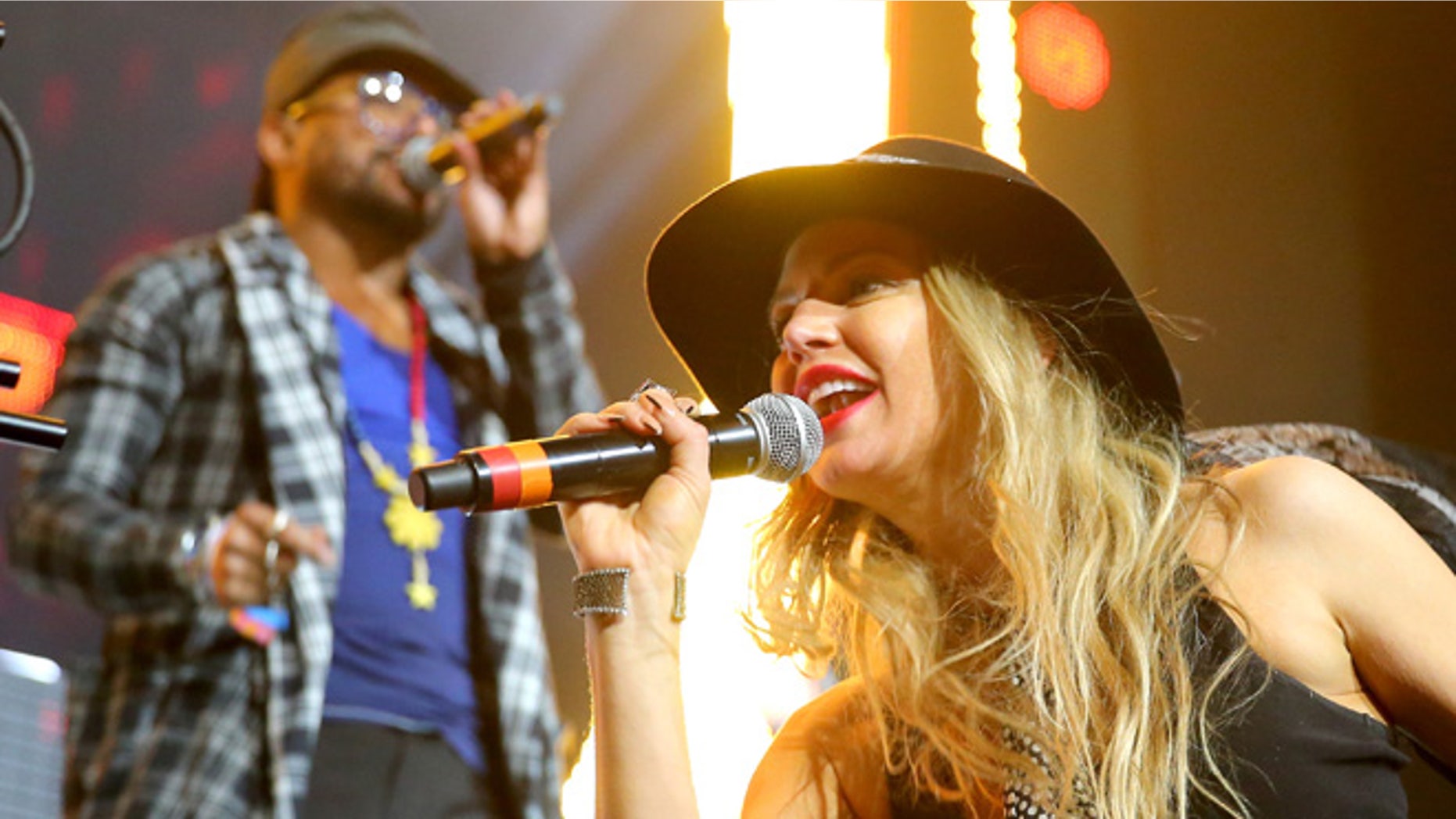 INDIO, CA - APRIL 12: Recording artists will.i.am (L) and Fergie of The Black Eyed Peas perform onstage with David Guetta during day 3 of the 2015 Coachella Valley Music & Arts Festival (Weekend 1) at the Empire Polo Club on April 12, 2015 in Indio, California. (Photo by Mark Davis/Getty Images for Coachella)