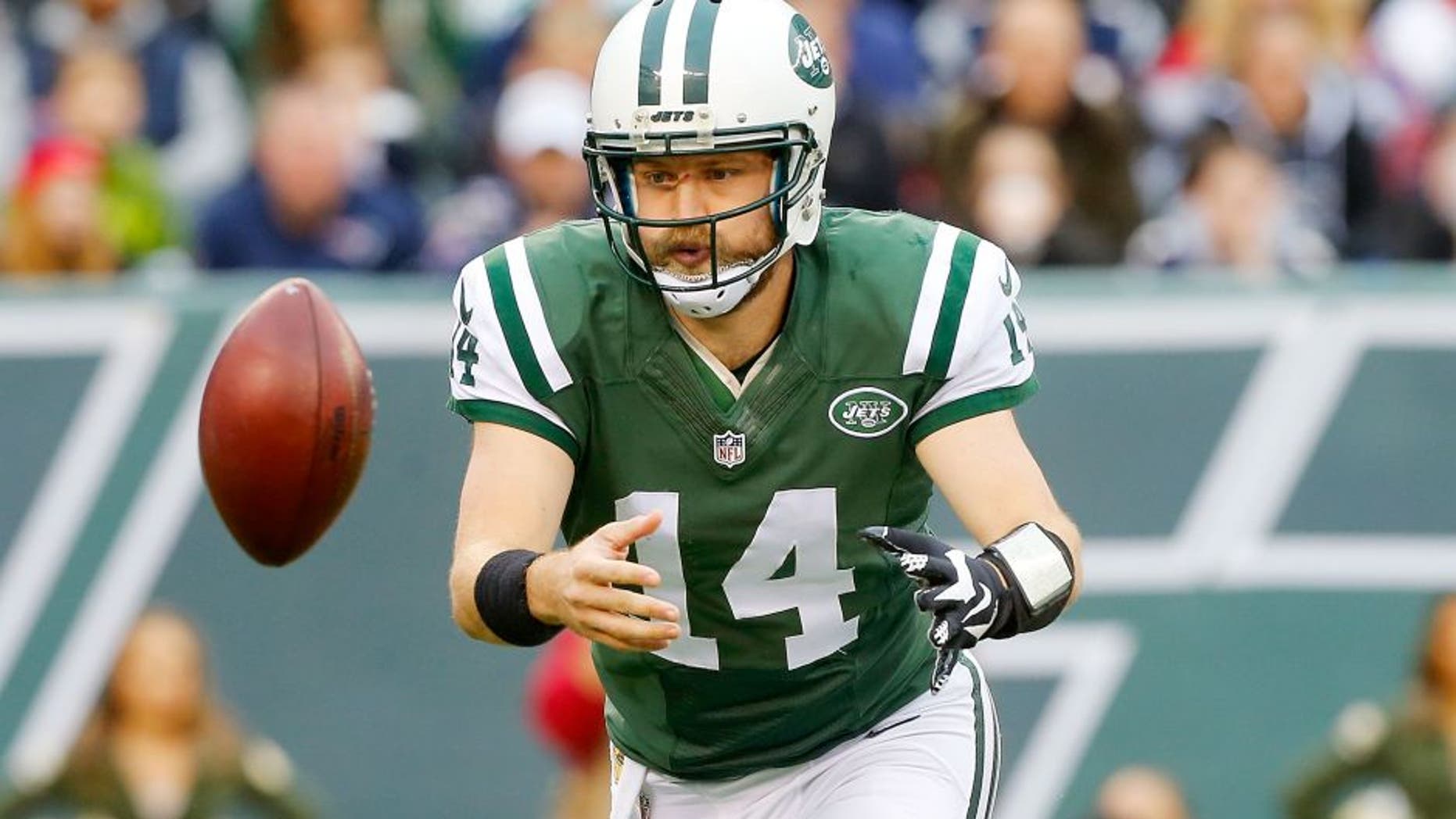 EAST RUTHERFORD, NJ - DECEMBER 27: (NEW YORK DAILIES OUT) Ryan Fitzpatrick #14 of the New York Jets in action against the New England Patriots on December 27, 2015 at MetLife Stadium in East Rutherford, New Jersey. The Jets defeated the Patriots 26-20 in overtime. (Photo by Jim McIsaac/Getty Images)