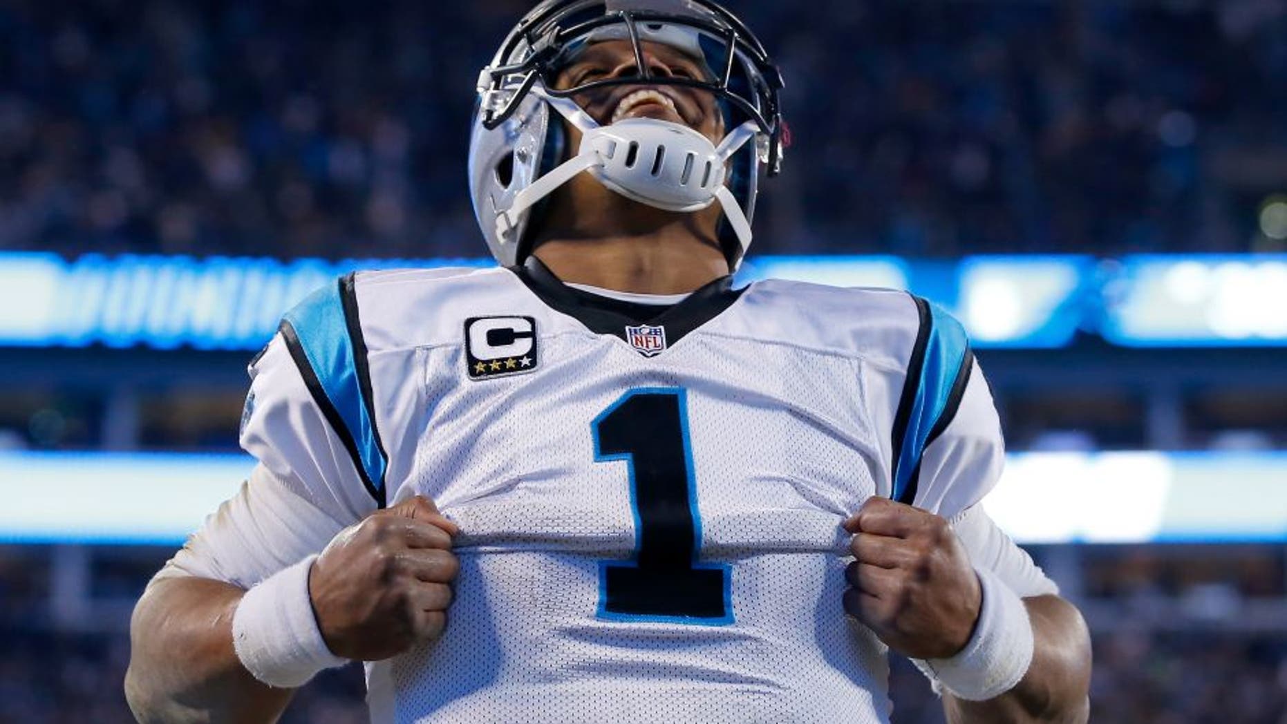 CHARLOTTE, NC - JANUARY 24: Cam Newton #1 of the Carolina Panthers celebrates after scoring a touchdown in the third quarter against the Arizona Cardinals during the NFC Championship Game at Bank of America Stadium on January 24, 2016 in Charlotte, North Carolina. (Photo by Kevin C. Cox/Getty Images)