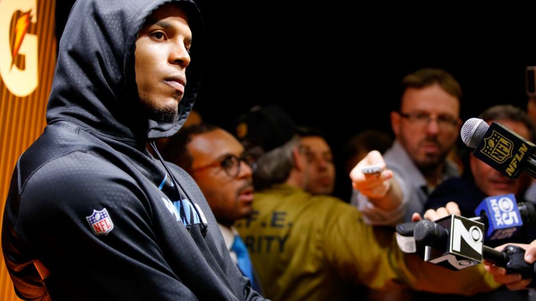 SANTA CLARA, CA - FEBRUARY 07: Cam Newton #1 of the Carolina Panthers reacts during his postgame press conference after the Denver Broncos defeated the Carolina Panthers with a score of 24 to 10 to win Super Bowl 50 at Levi's Stadium on February 7, 2016 in Santa Clara, California. (Photo by Kevin C. Cox/Getty Images)