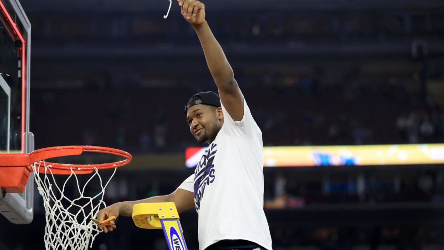 HOUSTON, TEXAS - APRIL 04: Kris Jenkins #2 of the Villanova Wildcats cuts the net after defeating the North Carolina Tar Heels 77-74 to win the 2016 NCAA Men's Final Four National Championship game at NRG Stadium on April 4, 2016 in Houston, Texas. (Photo by Ronald Martinez/Getty Images)