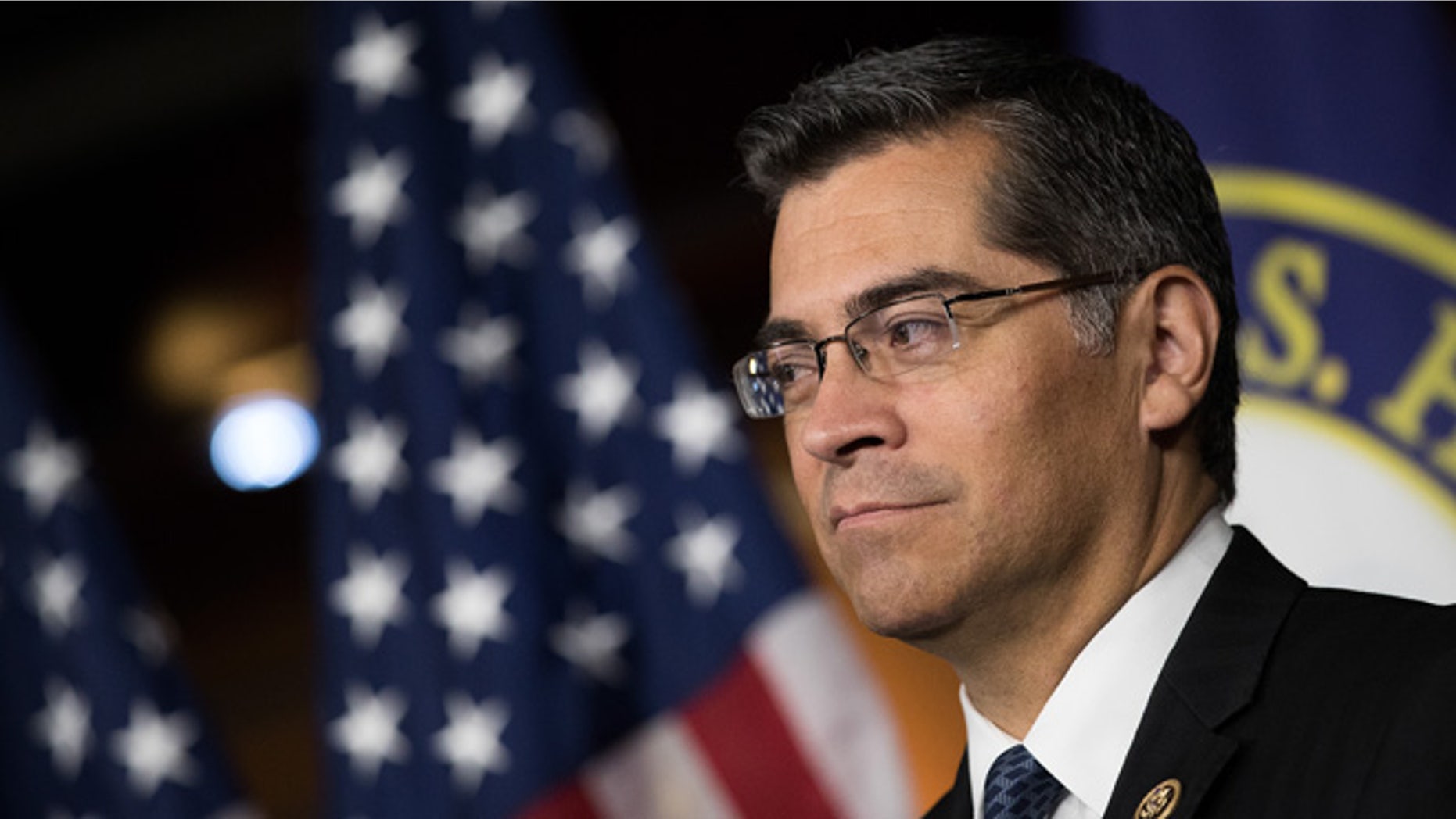 WASHINGTON, DC - MAY 11: Rep. Xavier Becerra (D-CA) listens during a news conference to discuss the rhetoric of presidential candidate Donald Trump, at the U.S. Capitol, May 11, 2016, in Washington, DC. Donald Trump is scheduled to meet with Speaker of the House Paul Ryan on Thursday near Capitol Hill. (Photo by Drew Angerer/Getty Images)