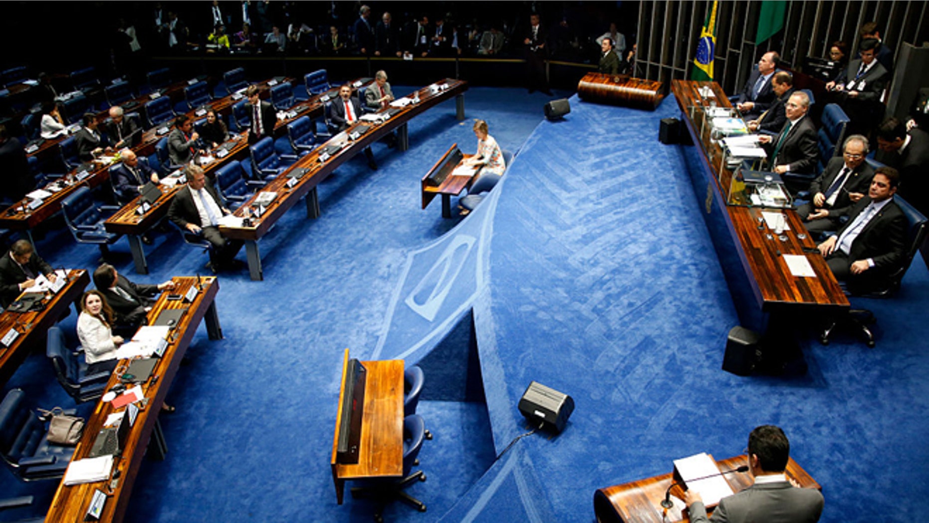 BRASILIA, BRAZIL - MAY 11: Lawmakers gather during a special session in the Brazilian Senate to vote on whether to accept impeachment charges against embattled Brazilian President Dilma Rousseff on May 11, 2016 in Brasilia, Brazil. A loss for Rousseff could force her to step down from the presidency for 180 days and face trial on charges of allegedly manipulating government accounts. (Photo by Igo Estrela/Getty Images)