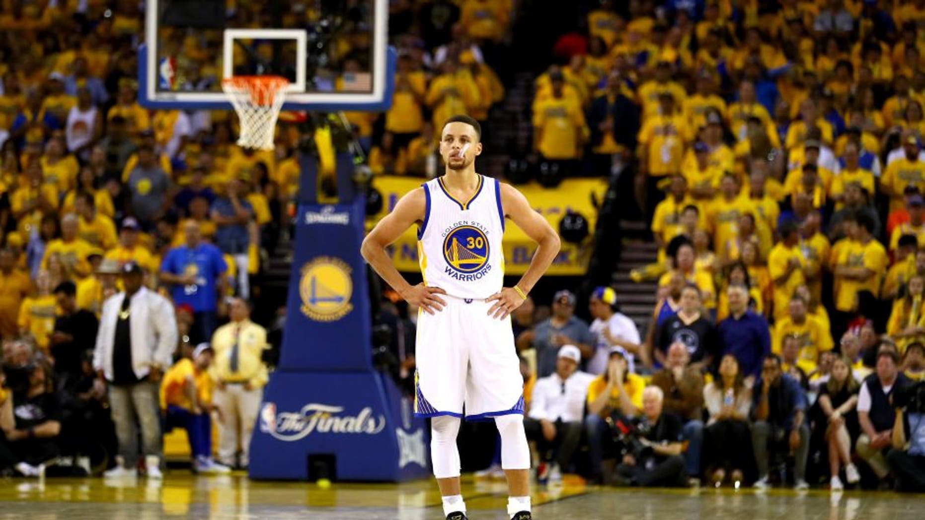 OAKLAND, CA - JUNE 19: Stephen Curry #30 of the Golden State Warriors stands on the court against the Cleveland Cavaliers in Game 7 of the 2016 NBA Finals at ORACLE Arena on June 19, 2016 in Oakland, California. NOTE TO USER: User expressly acknowledges and agrees that, by downloading and or using this photograph, User is consenting to the terms and conditions of the Getty Images License Agreement. (Photo by Ezra Shaw/Getty Images)