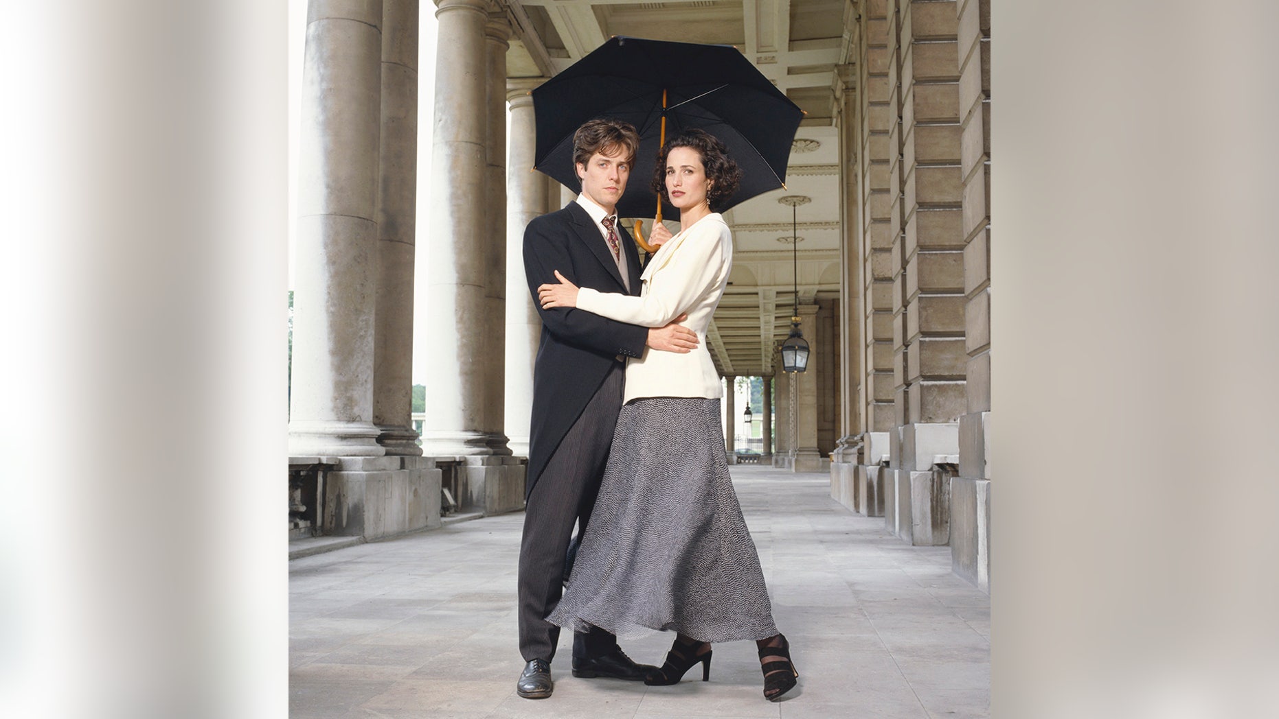 Actor Hugh Grant and actress Andie MacDowell posing as their characters from Richard Curtis' 1994 comedy "Four Weddings and a Funeral."