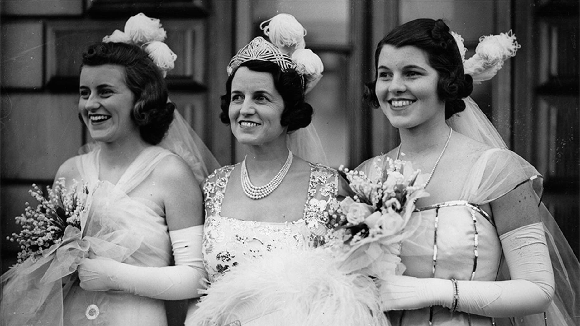 Rose Kennedy (center), mother of John F. Kennedy, poses with two of her daughters: Kathleen (left) and Rosemary (right).