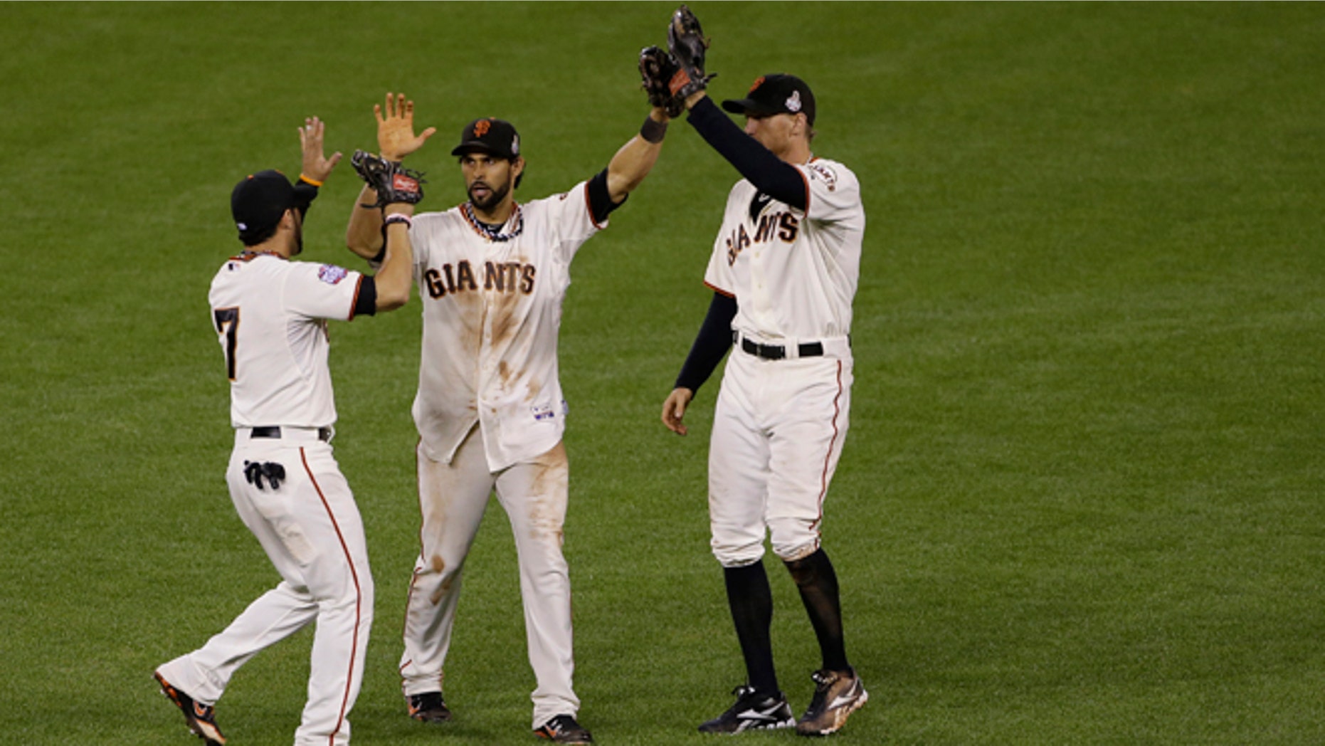 Oct. 25, 2012: San Francisco Giants' Gregor Blanco, left, Angel Pagan, middle, and Hunter Pence celebrates after the Giants defeated the Detroit Tigers, 2-0, in Game 2 of baseball's World Series in San Francisco.
