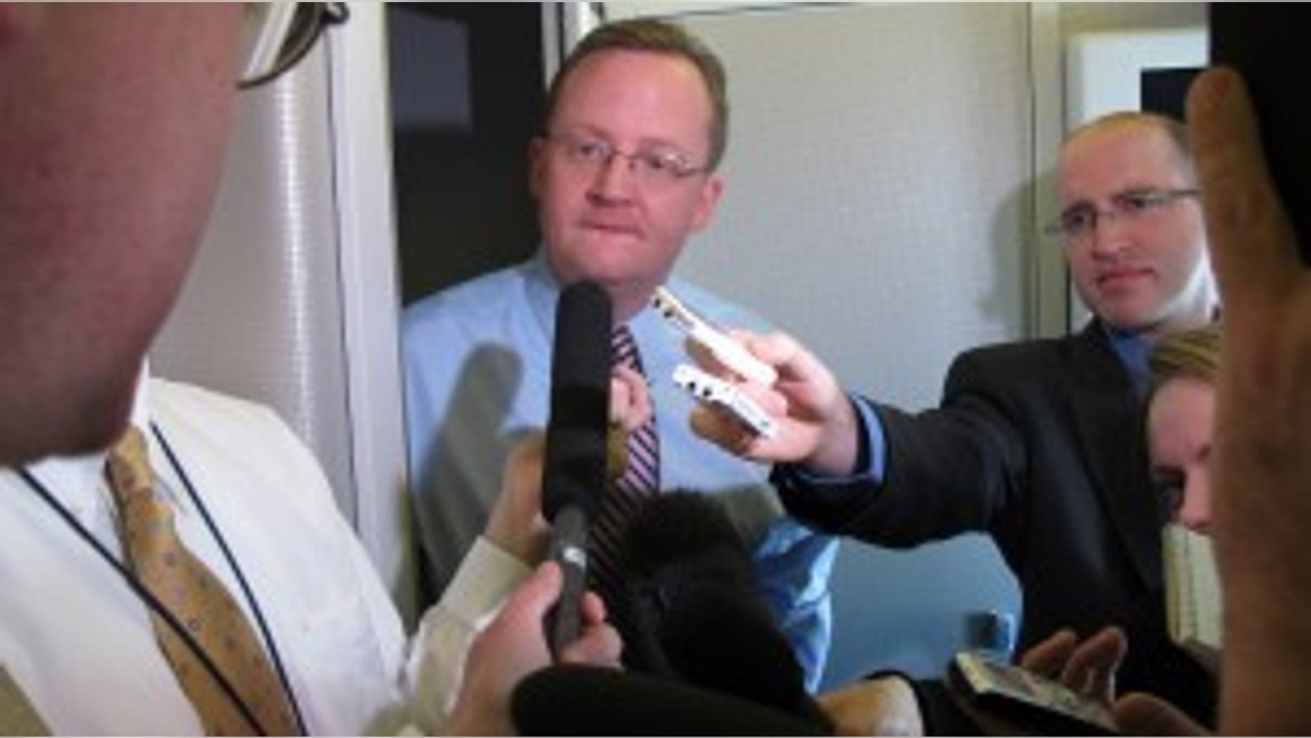 White House Press Secretary Robert Gibbs briefs reports on Air Force One