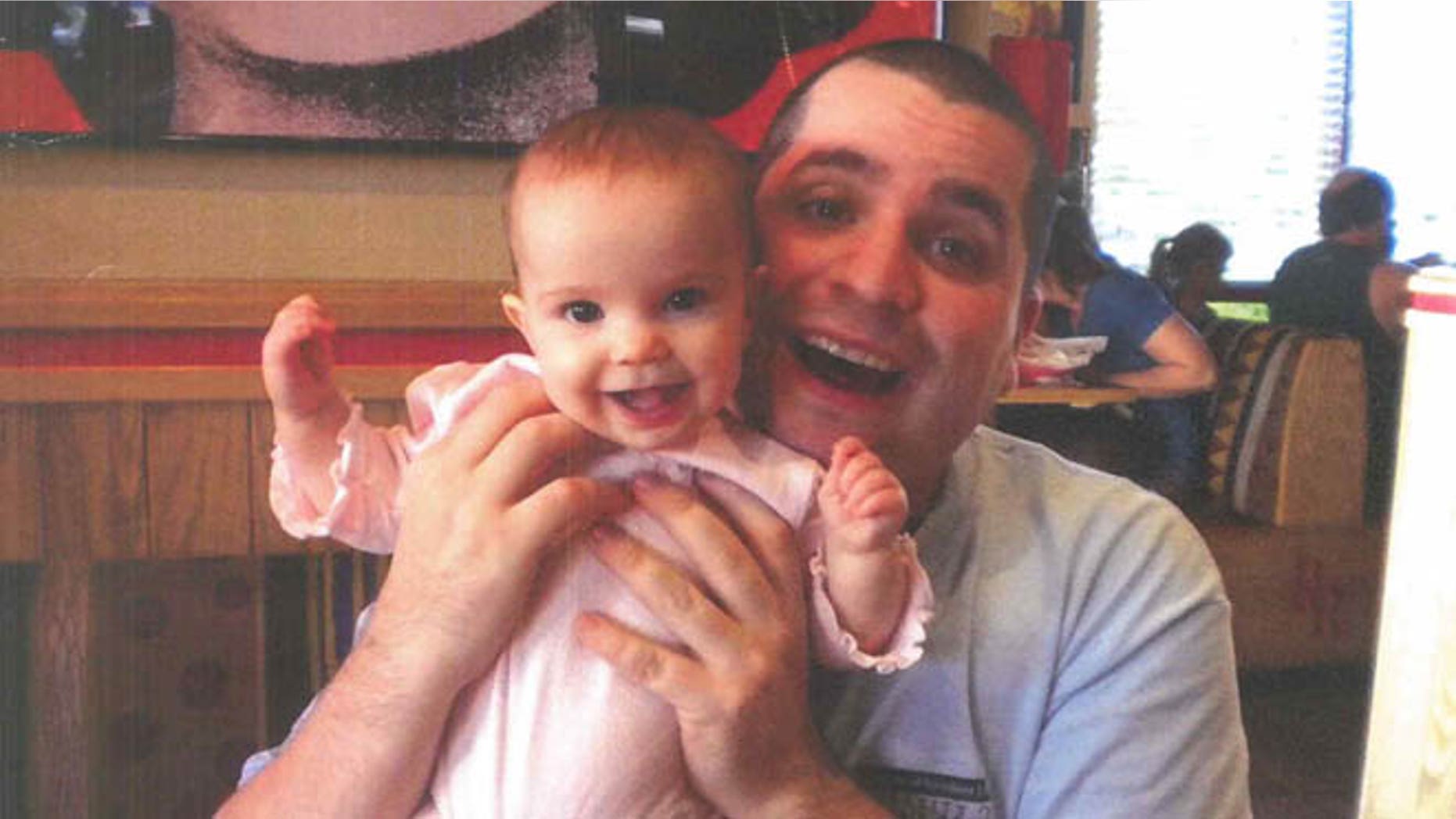 March 12, 2013: This undated file photo submitted into evidence by defense attorney Julia L. Gatto shows New York City police Officer Gilberto Valle with his daughter. Valle, accused of plotting to kidnap, cook and eat women _ including his wife _ was convicted of conspiracy.