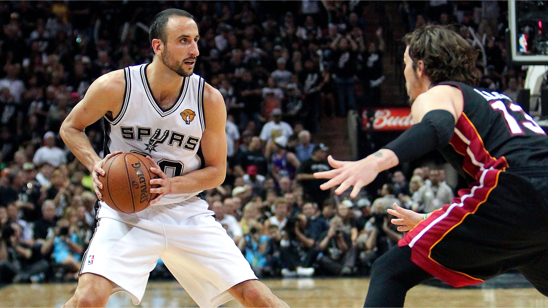 San Antonio guard Manu Ginobili, left, of Argentina, looks to pass against Miami Heat forward Mike Miller during the fourth quarter of Game 5 in the NBA Finals in San Antonio on Sunday, June 16, 2013. (AP Photo/El Nuevo Herald, David Santiago)