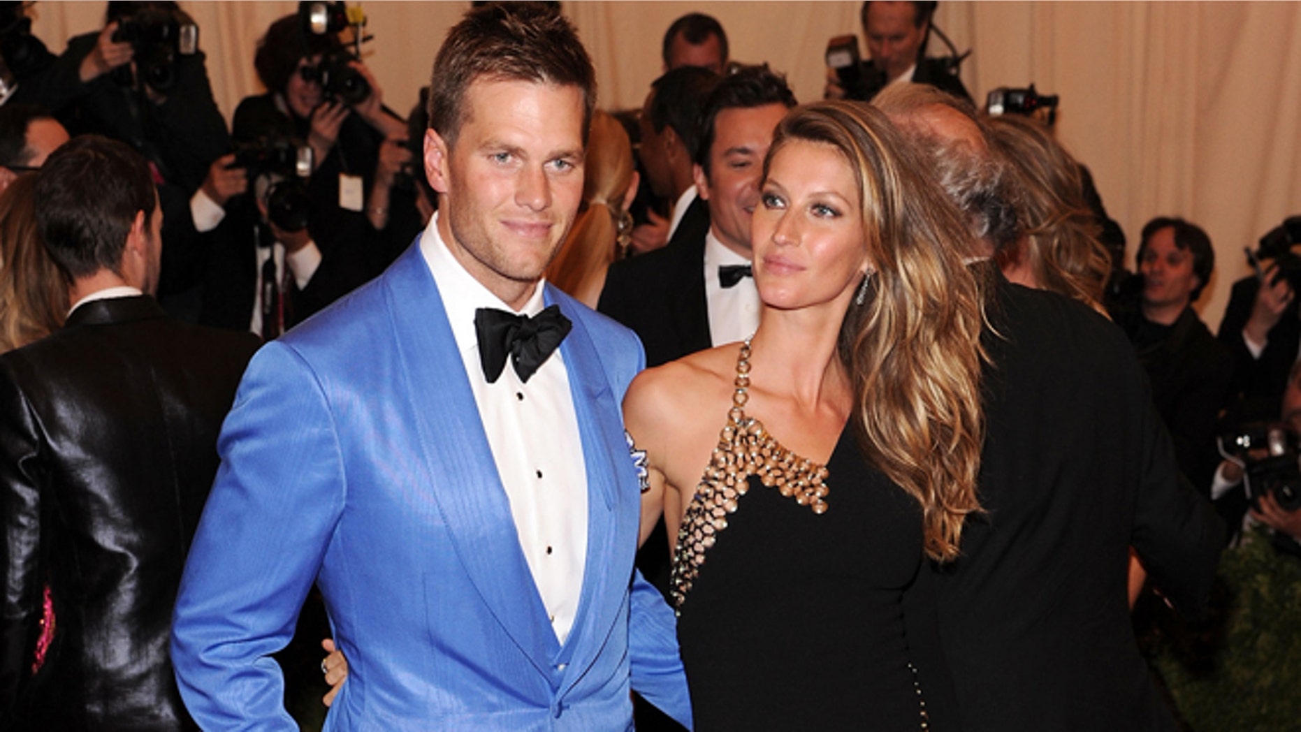 NEW YORK, NY - MAY 06: NFL player Tom Brady (L) and model Gisele Bundchen attend the Costume Institute Gala for the "PUNK: Chaos to Couture" exhibition at the Metropolitan Museum of Art on May 6, 2013 in New York City. (Photo by Jamie McCarthy/Getty Images for The Huffington Post)