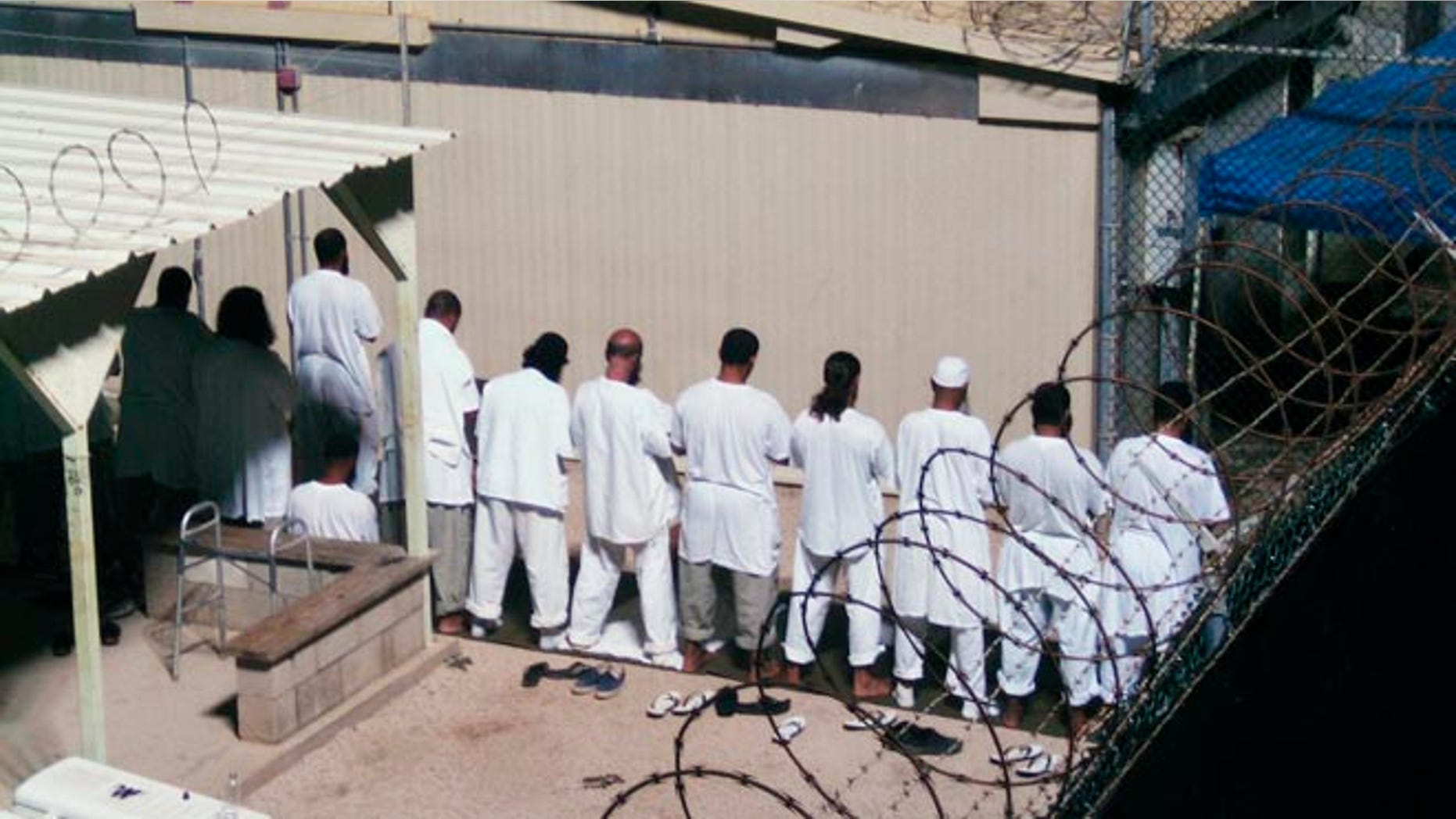 FILE: 2009: Detainees prayer at a detention facility at Guantanamo Bay U.S. Naval Base, in Cuba.