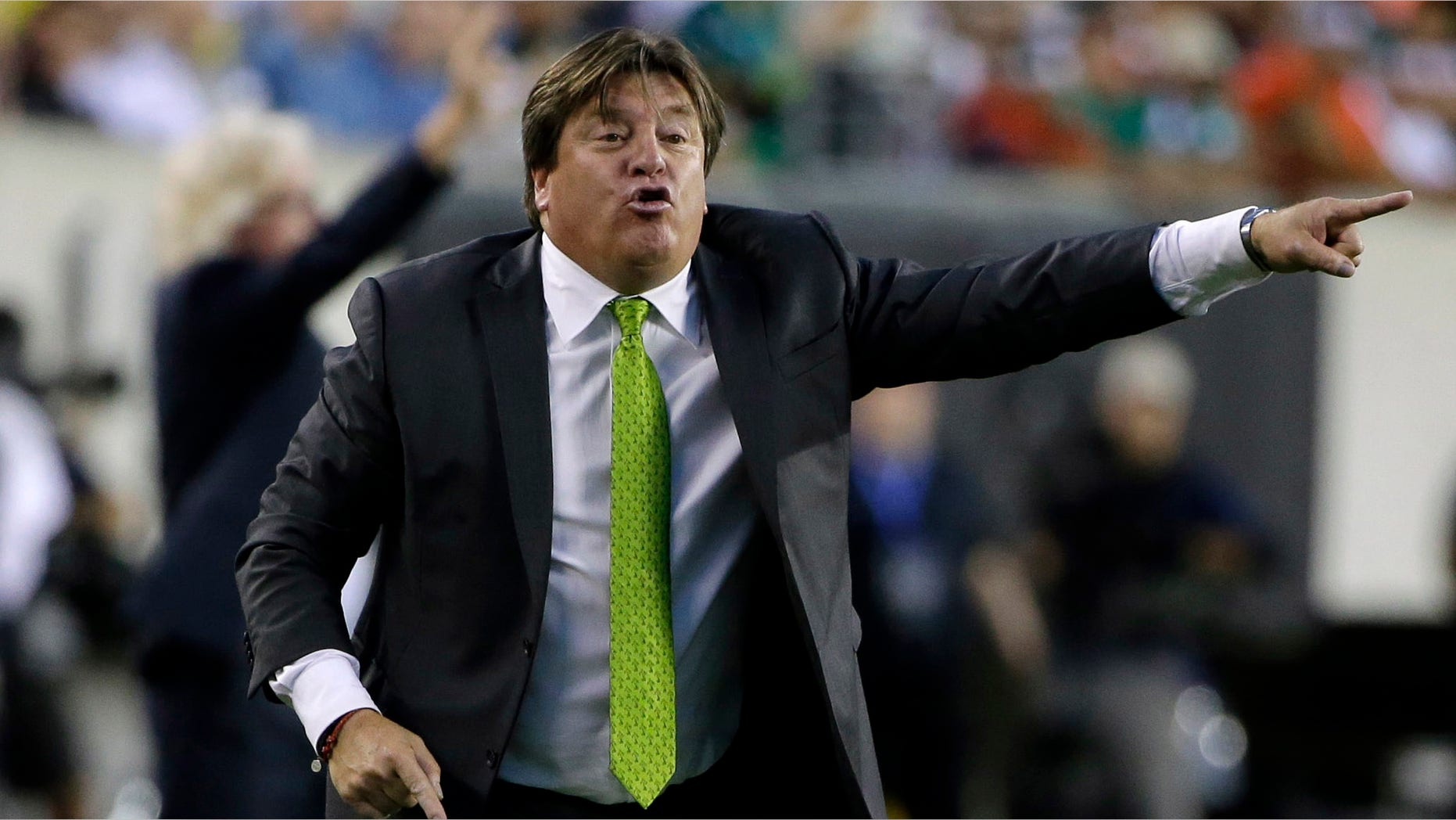 Mexico head coach Miguel Herrera yells during the first half of the CONCACAF Gold Cup championship soccer match against Jamaica, Sunday, July 26, 2015, in Philadelphia. (AP Photo/Matt Rourke)