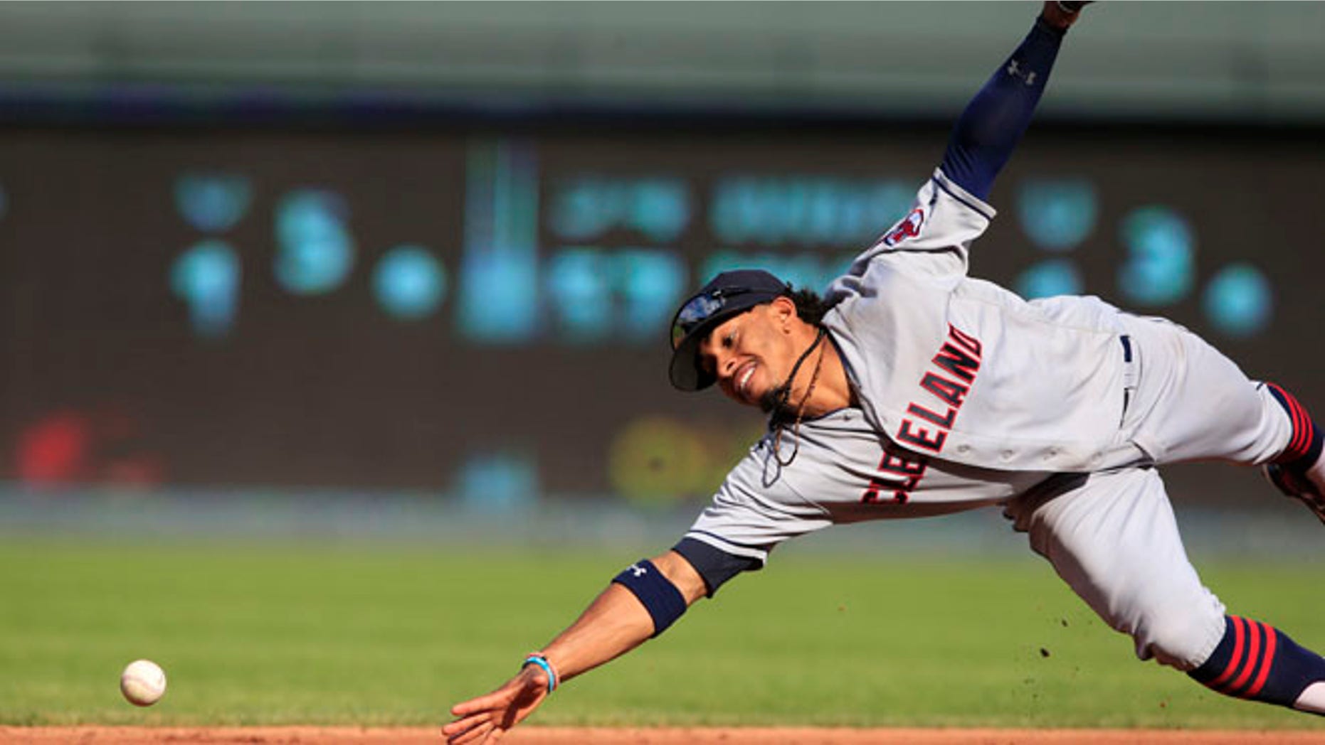 FILE - In this Oct. 1, 2016, file photo, Cleveland Indians shortstop Francisco Lindor dives for a ground ball hit by Kansas City Royals' Drew Butera during a baseball game at Kauffman Stadium in Kansas City, Mo. Lindor won a Gold Glove award, announced Tuesday, Nov. 8, by Rawlings. He is a first-time winner. (AP Photo/Orlin Wagner, File)