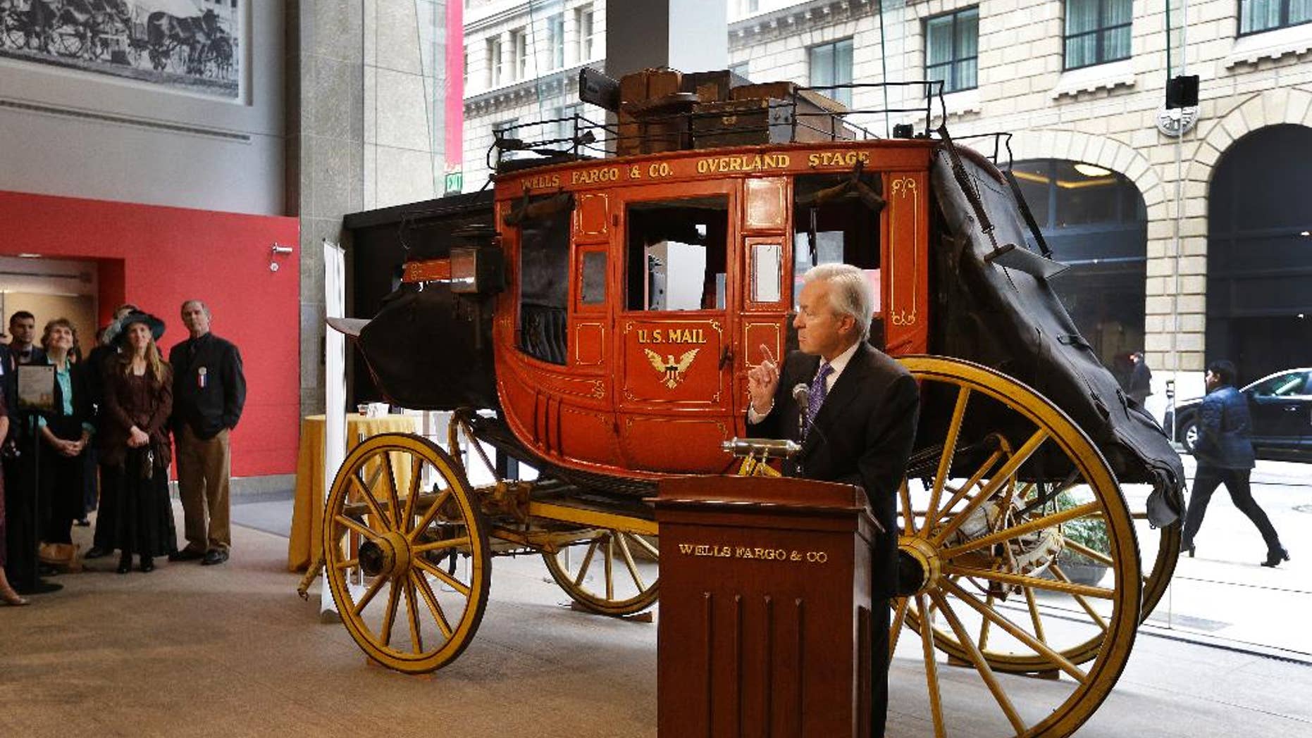 Wells Fargo CEO John Stumpf gestures while speaking during a media conference Thursday, Feb. 19, 2015, in San Francisco. The popular history museum in the heart of San Francisco's financial district is reopening weeks after thieves smashed a stolen vehicle through its front door and made off with historic gold nuggets on display. (AP Photo/Ben Margot)
