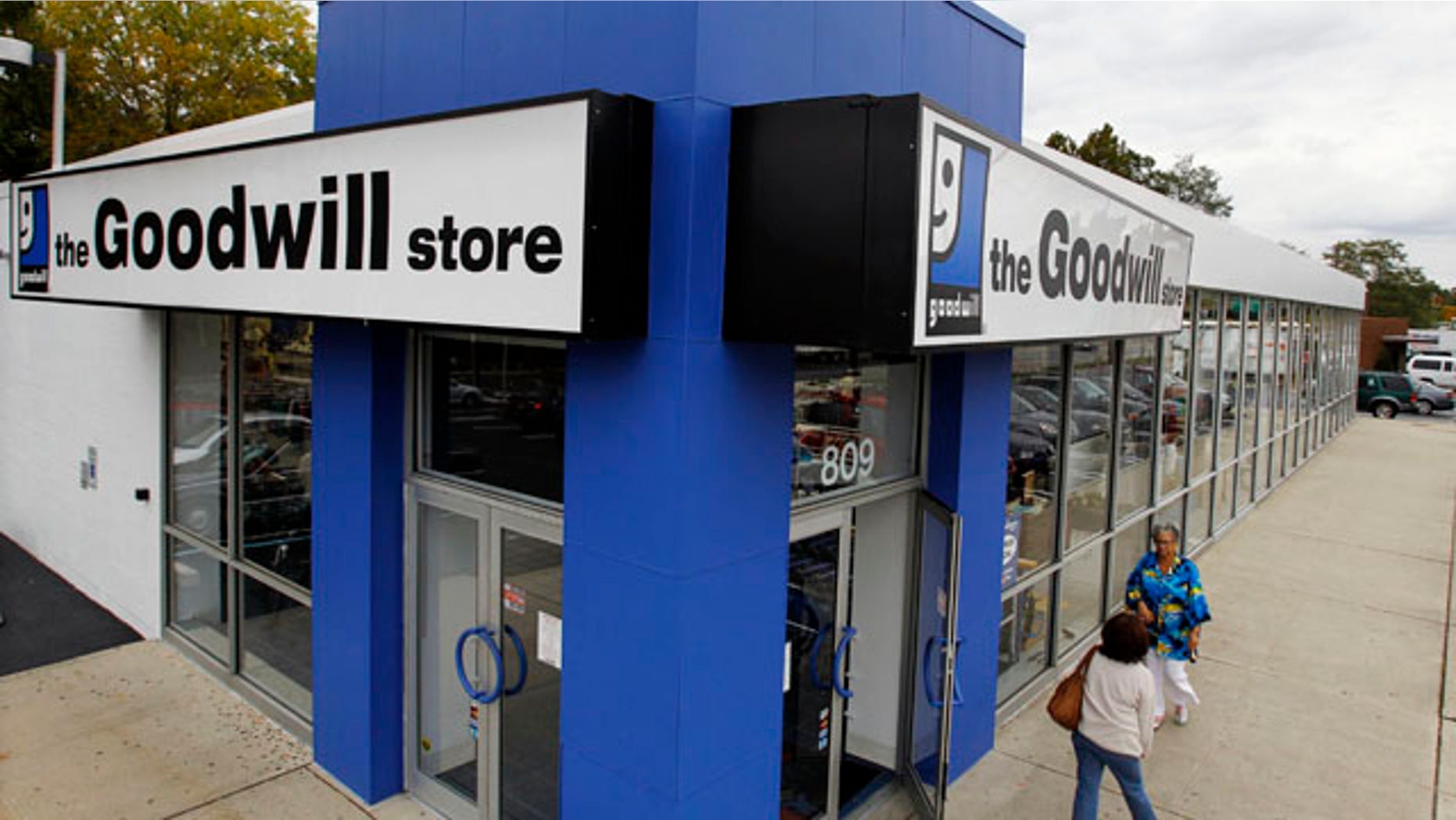 Oct. 14: Shoppers go into a Goodwill store in Paramus, N.J. The Paramus store is one of 100 new locations for the non-profit chain--many are in middle-class suburbs.