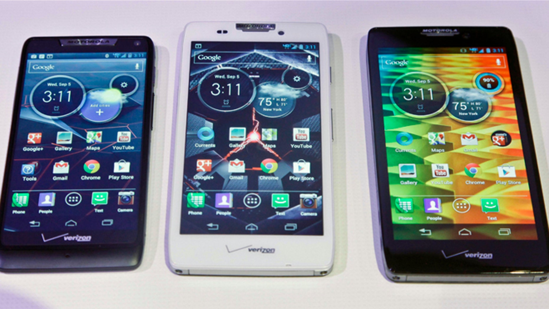 Sept. 5, 2012: Motorola's three new Droid Razr smartphones, the Droid Razr M, center, the Droid Razr HD, center, and the Droid Razr Maxx HD, are unveiled at a press conference. The phones are the first from Motorola as a part of Google.
