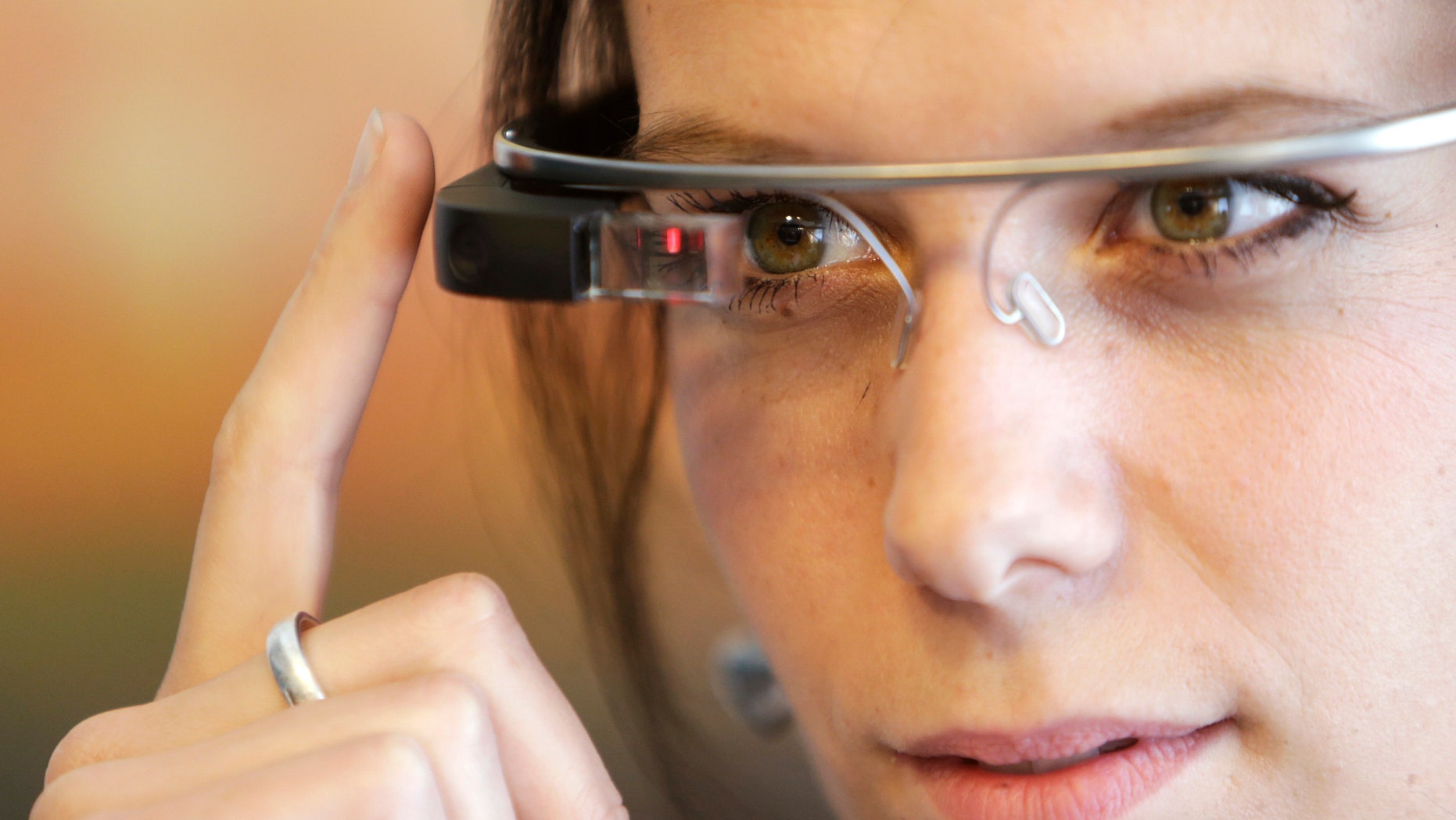 A woman wears Google glasses after a media presentation of a Google apartment in Prague May 15, 2014.