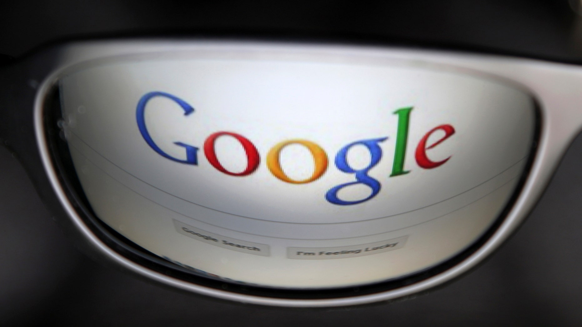 A Google search page is reflected in sunglasses in this photo illustration taken in Brussels May 30, 2014. Google has taken the first steps to meet a European ruling that citizens can have objectionable links removed from Internet search results, a ruling that pleased privacy campaigners but raised fears that the right can be abused to hide negative information. REUTERS/Francois Lenoir (BELGIUM - Tags: POLITICS SCIENCE TECHNOLOGY) - RTR3RK9G