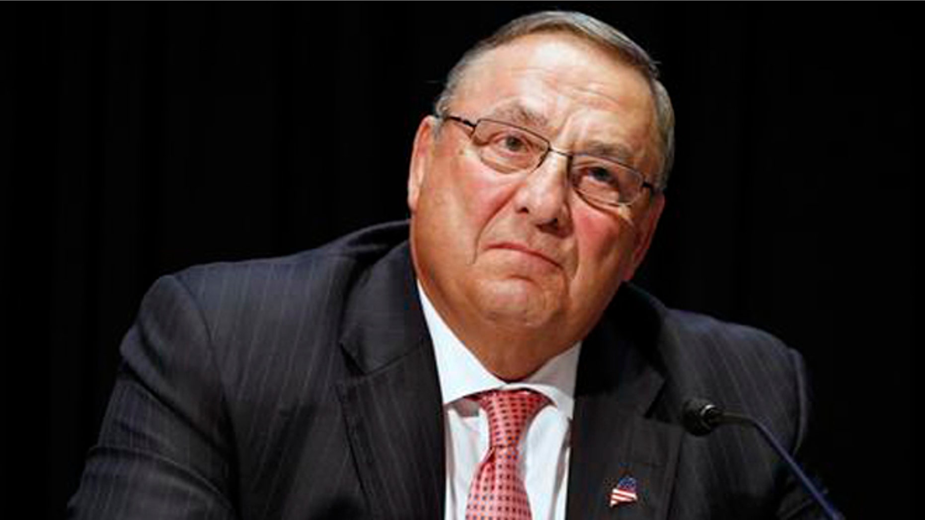 FILE- In this June 7, 2016, file photo, Maine Gov. Paul LePage attends an opioid abuse conference in Boston. LePage is being accused again of making racially insensitive comments, this time by saying photos he's collected in a binder of drug dealers arrested in the state show more than 90 percent of them are black or Hispanic. The governor made the remark at a town hall in North Berwick, Maine, Wednesday, Aug. 24, 2016. (AP Photo/Michael Dwyer, File)