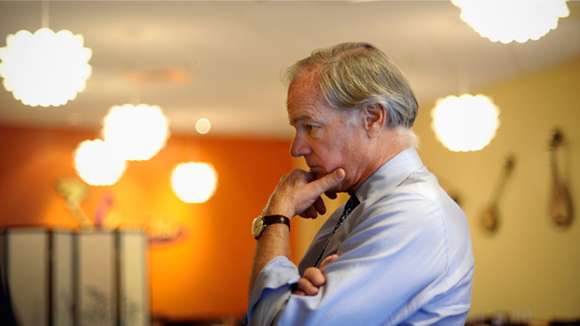 In this Thursday, Sept. 18, 2014 photo, Republican candidate for Connecticut governor Tom Foley listens to a business owner during a campaign stop in Middletown, Conn.