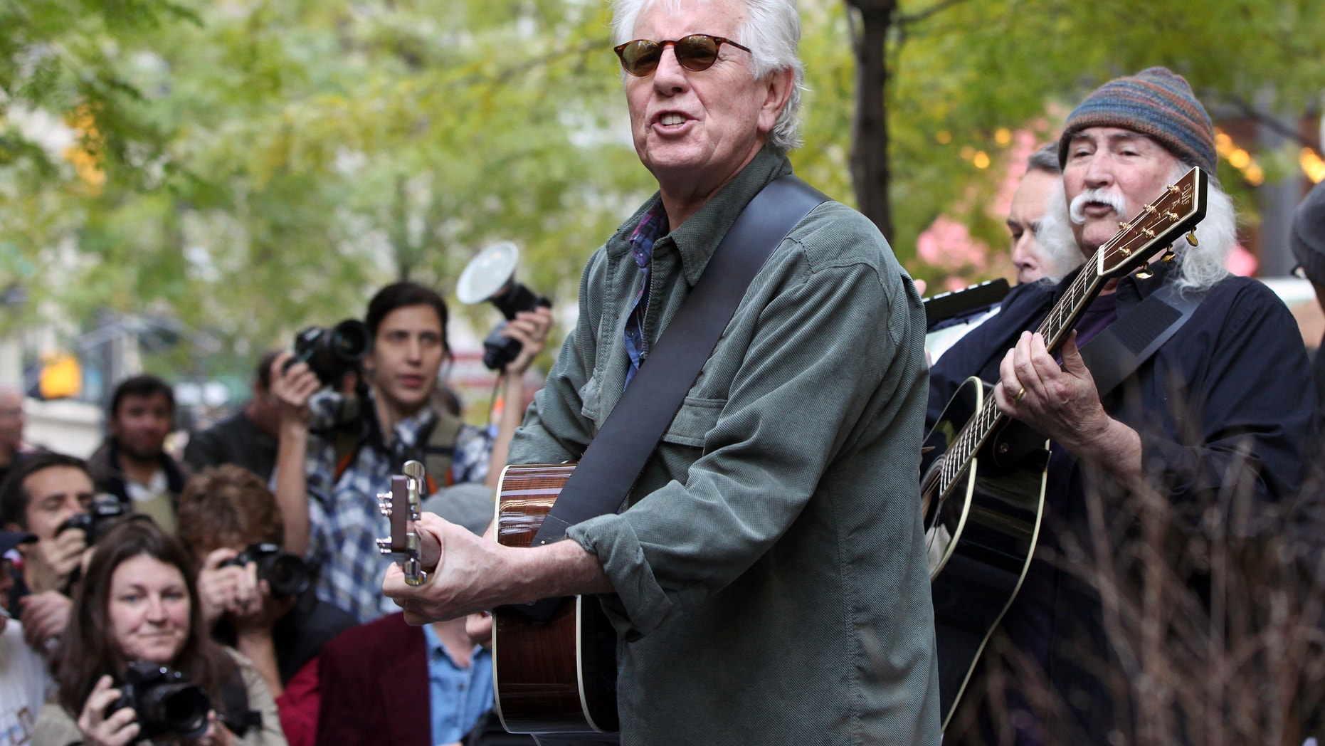 Musicians Graham Nash, second right, and David Crosby perform in Zuccotti Park where Occupy Wall Street campaign demonstrators have been occupying in New York November 8, 2011.